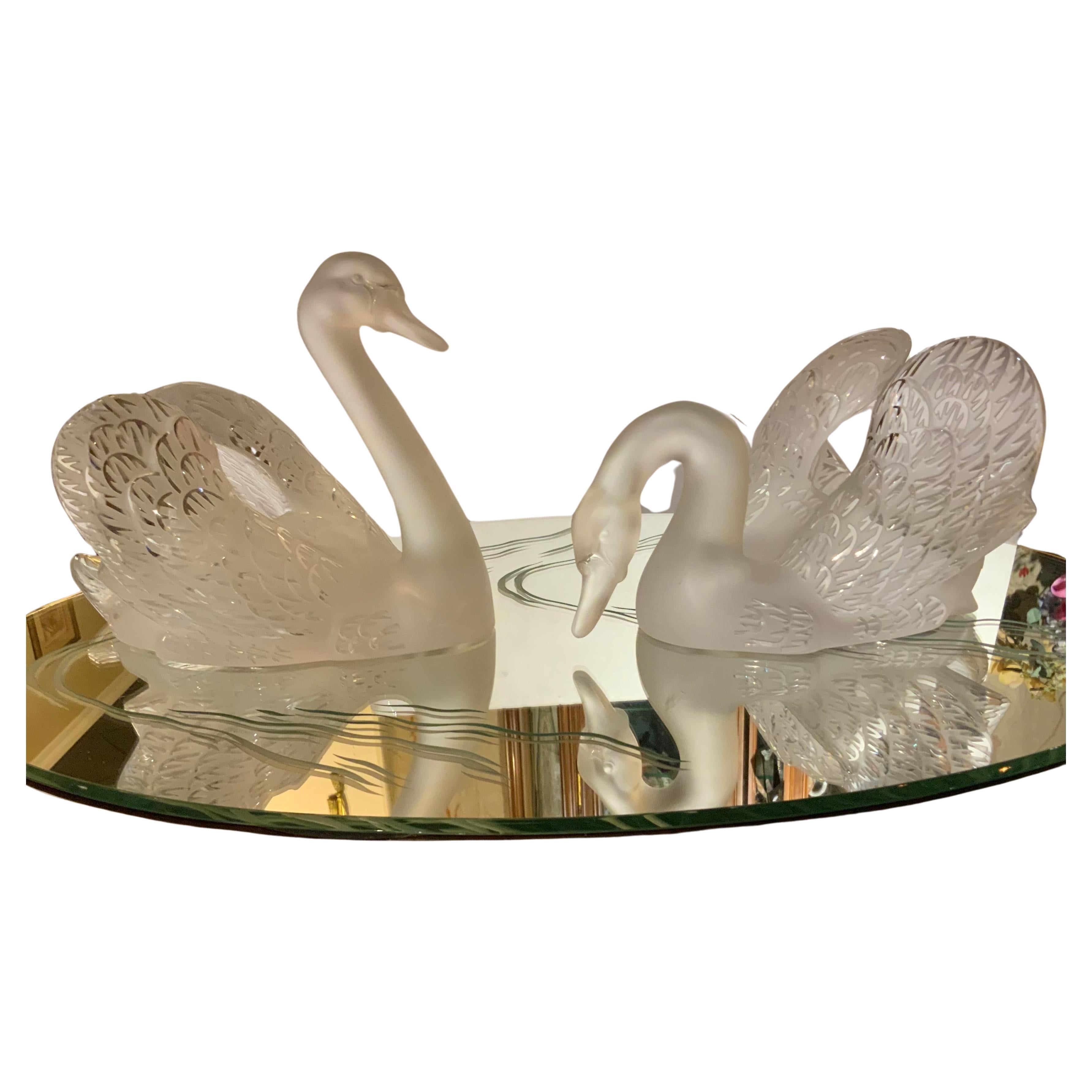 Lalique pair of frosted crystal swans on  mirror etched centerpiece 