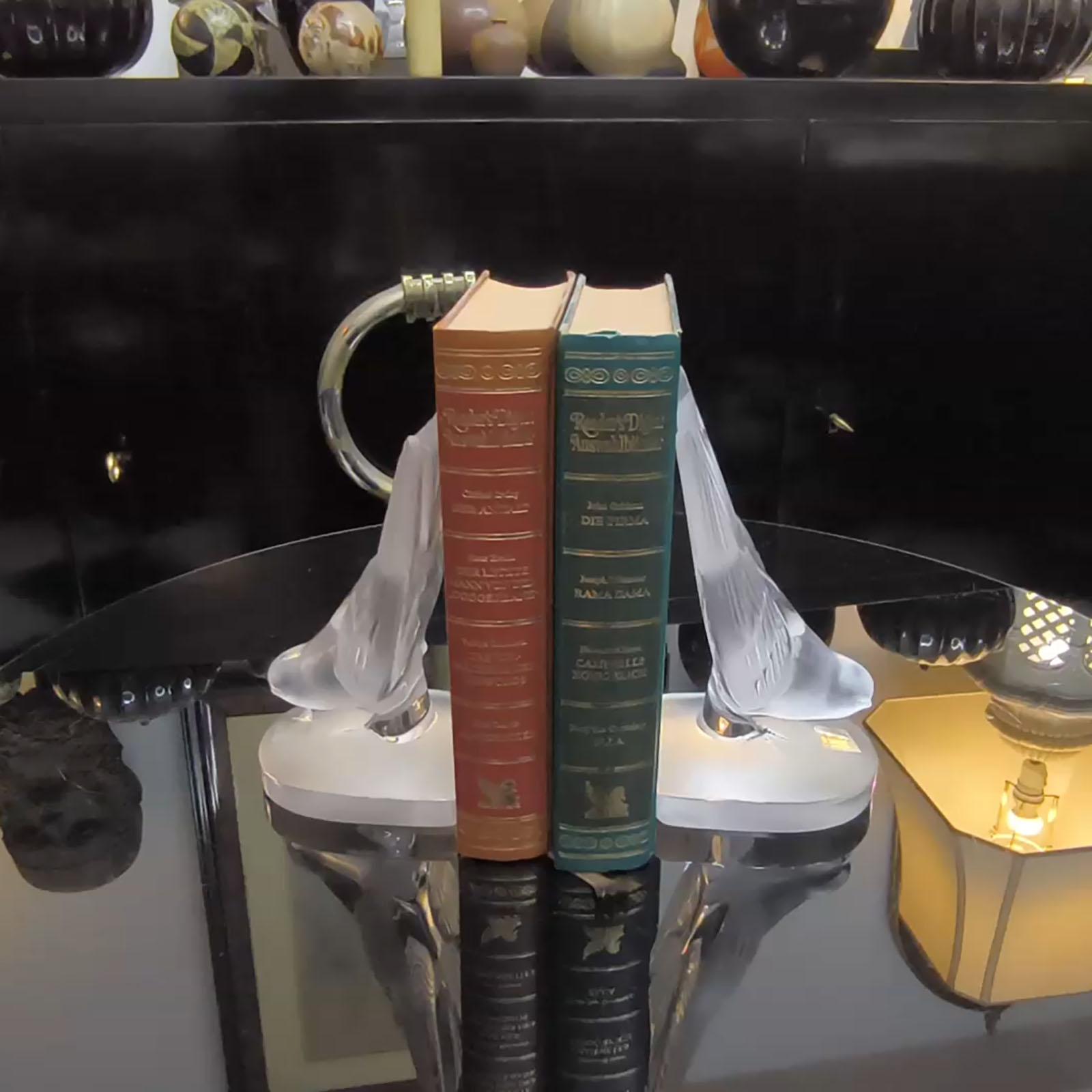 Lalique Crystal Hirondelle Bookends or paperweights shaped in the form of a diving swallow bird.
A pair of René Lalique frosted and polished glass ‘Hirondelle’ book ends, 1950s.
Engraved signature ‘LALIQUE FRANCE’ under the bottom.
Both wear the