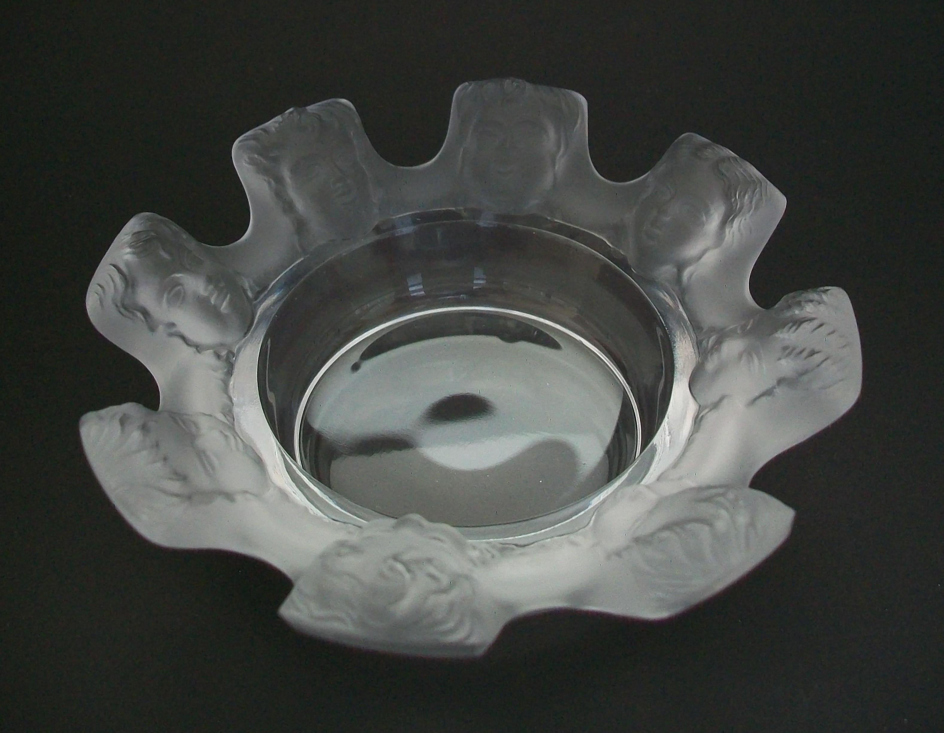 LALIQUE - 'Saint Nicolas' - Vintage luxury crystal ashtray or bowl with masks - striking frosted finish to the rim / masks - contrasting clear polished finish to the interior bowl and exterior walls and base - etched signature on the base - France -