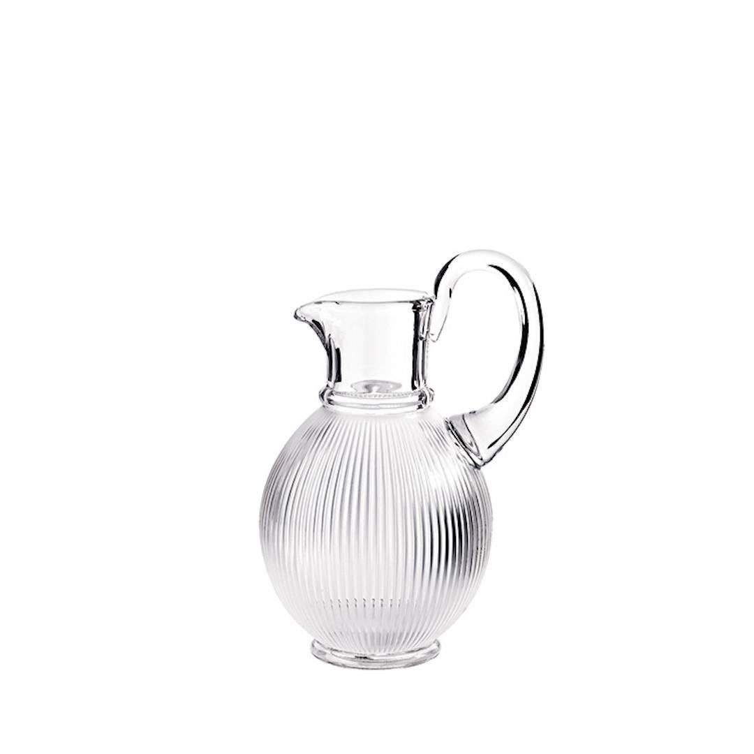 Designed in 1976 by René’s son Marc Lalique, this pattern has become iconic. Referencing both fluted antique columns and modernist architecture, it takes seven glass masters to create this glass using the time-honored techniques of soufflé tourne