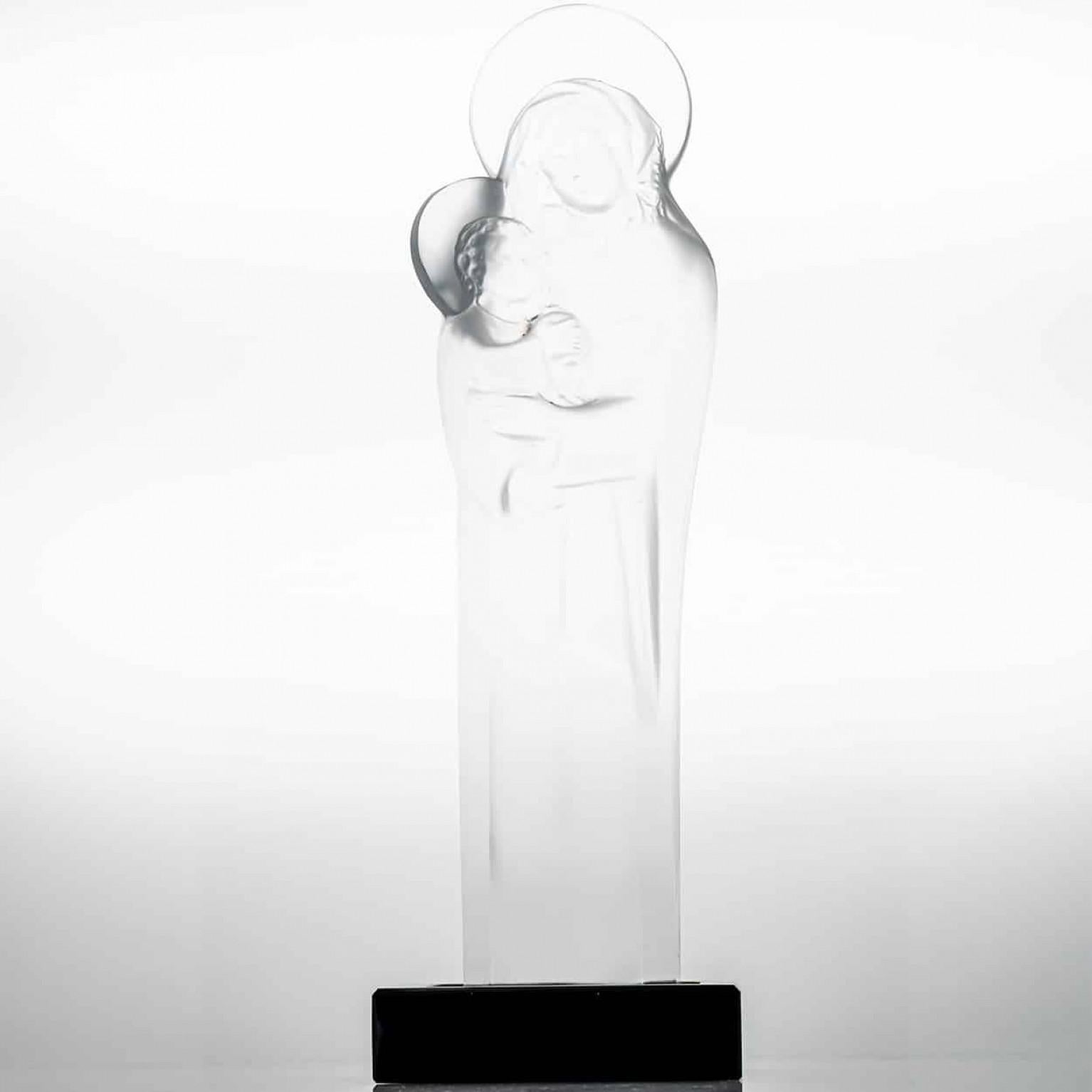 Luxury at its finest,  A collector’s item made by Lalique in France. This high-end piece is made by Lalique.

The Lalique Madonna and child is a radiant crystal sculpture. Crafted with purity and grace, it reflects peace, devotion, and the timeless