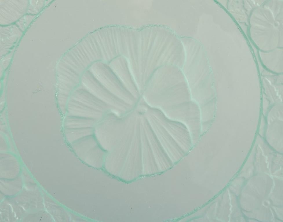 Mid-20th Century Lalique-style. Set of nine glass plates designed with flower motifs For Sale