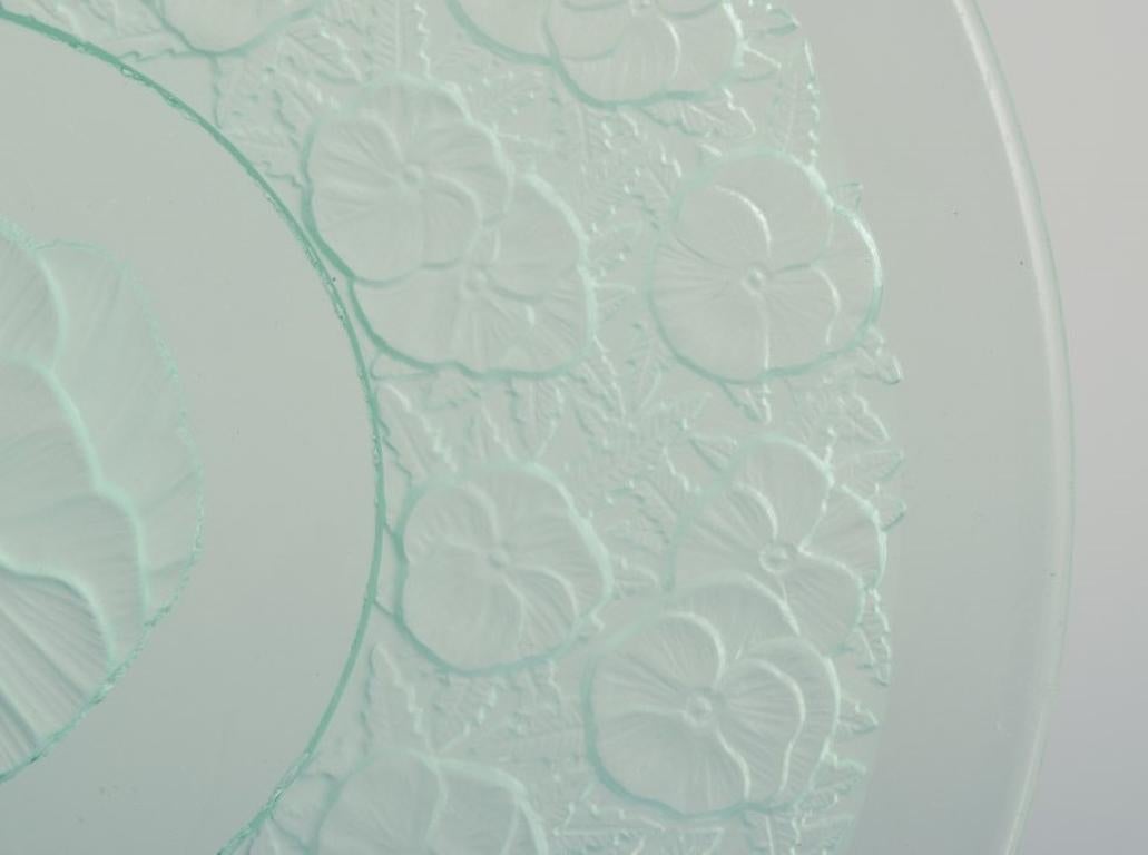 Glass Lalique-style. Set of nine glass plates designed with flower motifs For Sale