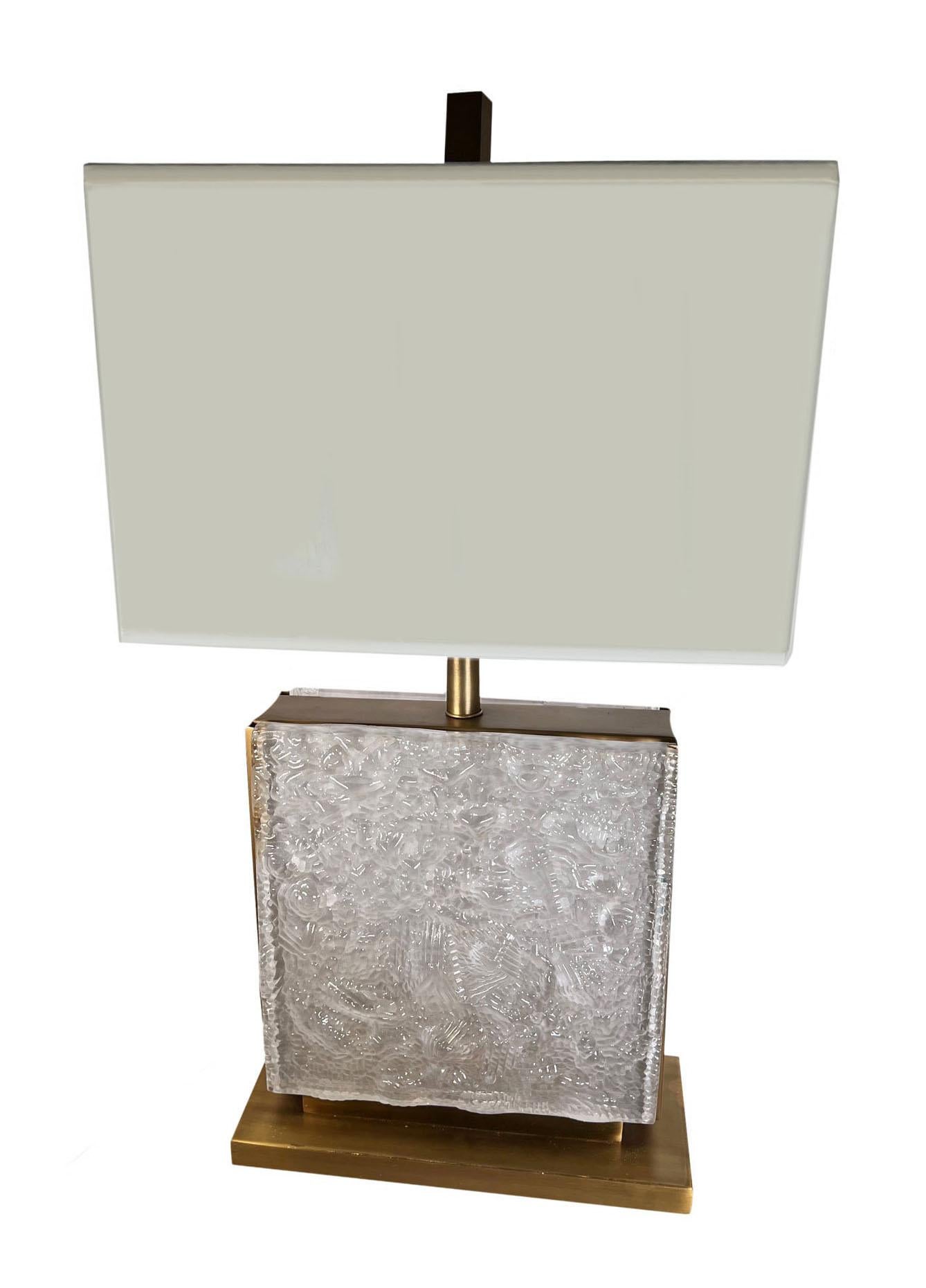 A pair of glamorous Lalique style square lamps with carved frosted glass on both the front and the back, there are two sheets of frosted glass on each lamp. Lampshades are included and the light bulb sits inside between each piece of glass. 