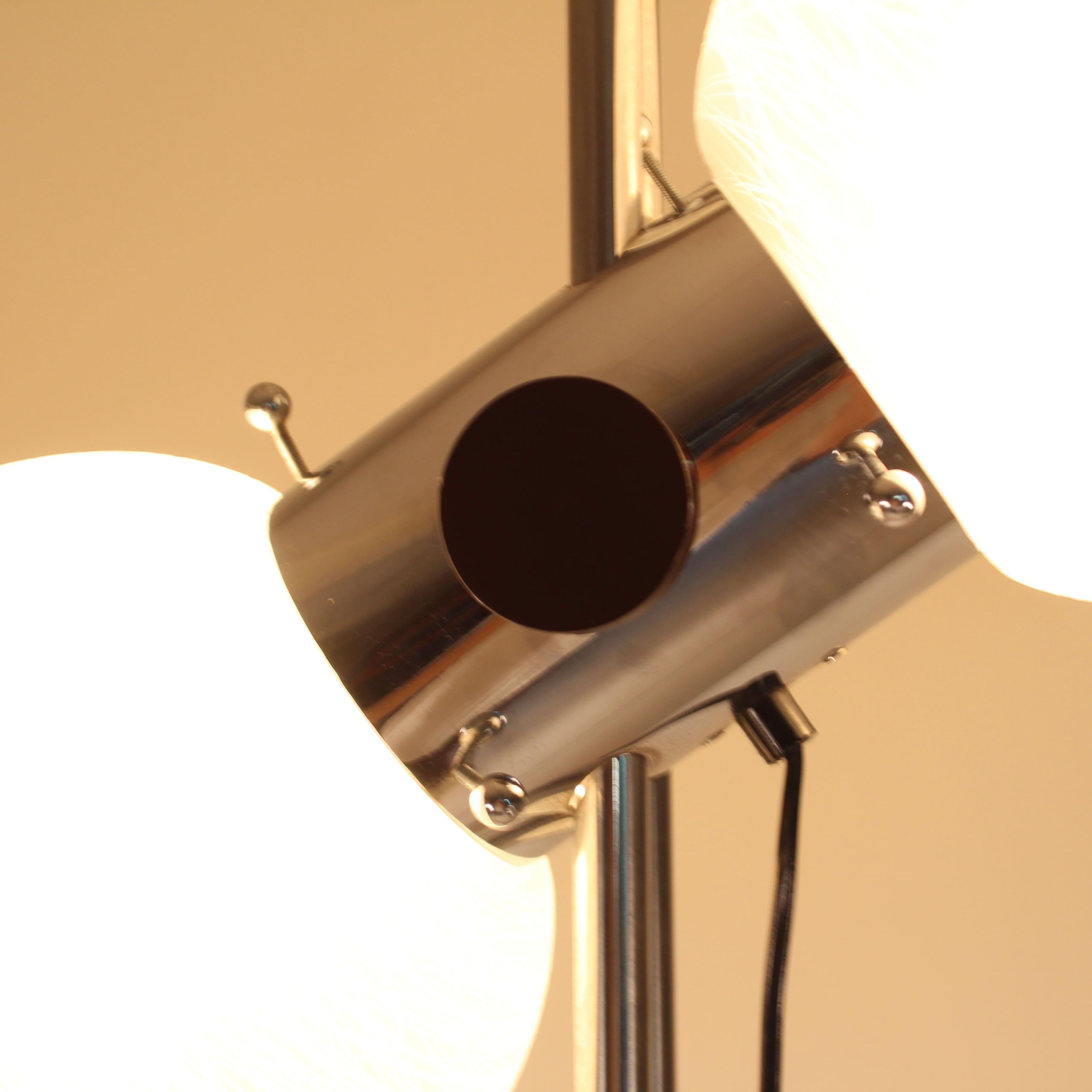 Adjustable floor lamp, steel and glass, Zonca, 1970, height adjustable, with a wheel mechanism. Slight signs due to time and wear. 