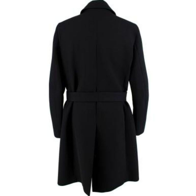 Salvatore Ferragamo Lamb Fur Trim Black Wool Trench Coat
 
 
 
 - Heavy weight, wool body 
 
 - Deep navy, lambs fur panel
 
 - Front button stand fastening 
 
 - Waist belt fastening 
 
 - Welt pockets
 
 - Fully lined with black silk 
 
 - Back