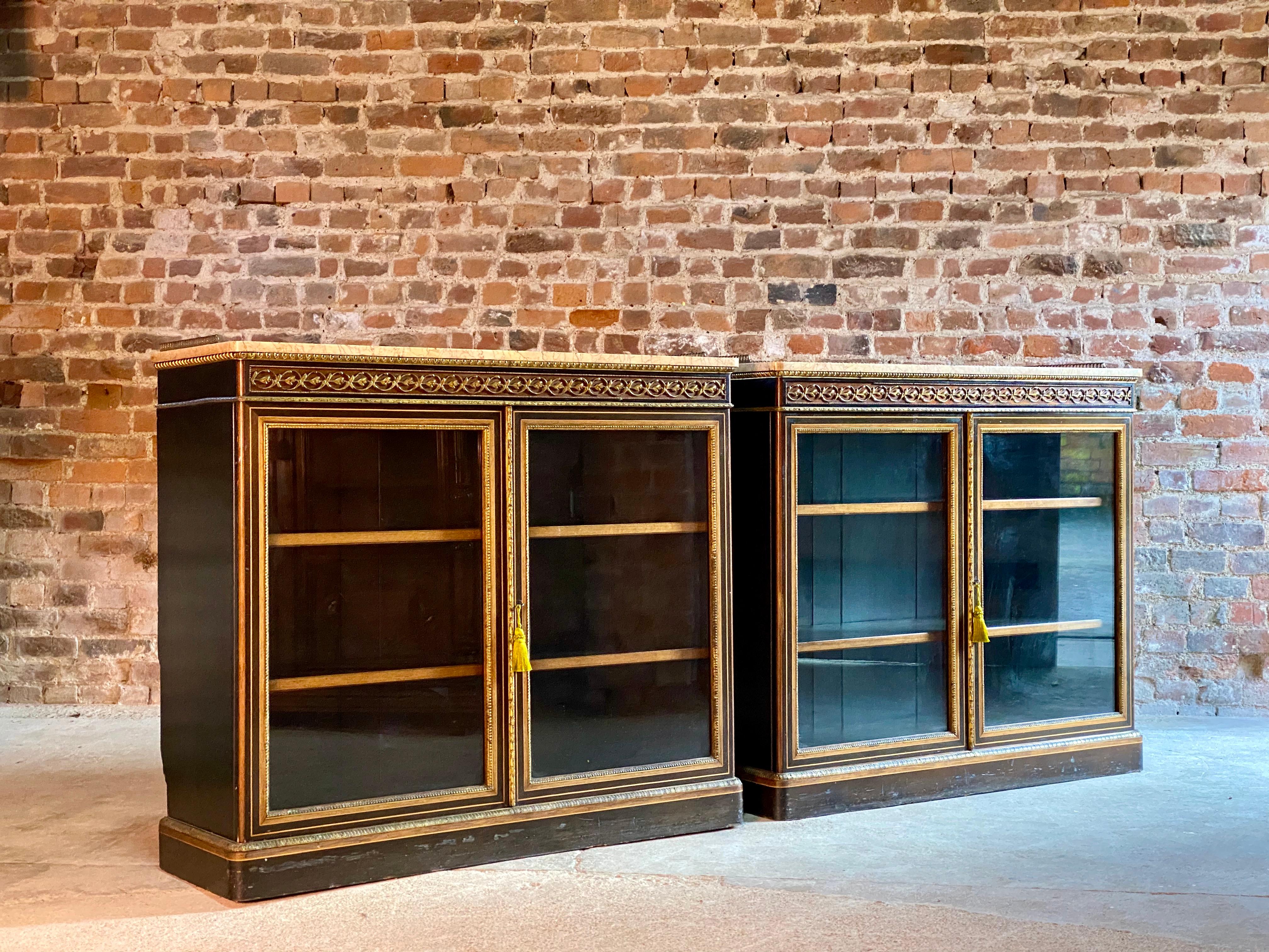 James Lamb of Manchester pair of ebonized, walnut & gilt metal mounted pier cabinets, circa 1850

A pair of important and rare matching pair of 19th century James Lamb of Manchester ebonized, walnut and gilt metal mounted pier cabinets bookcases