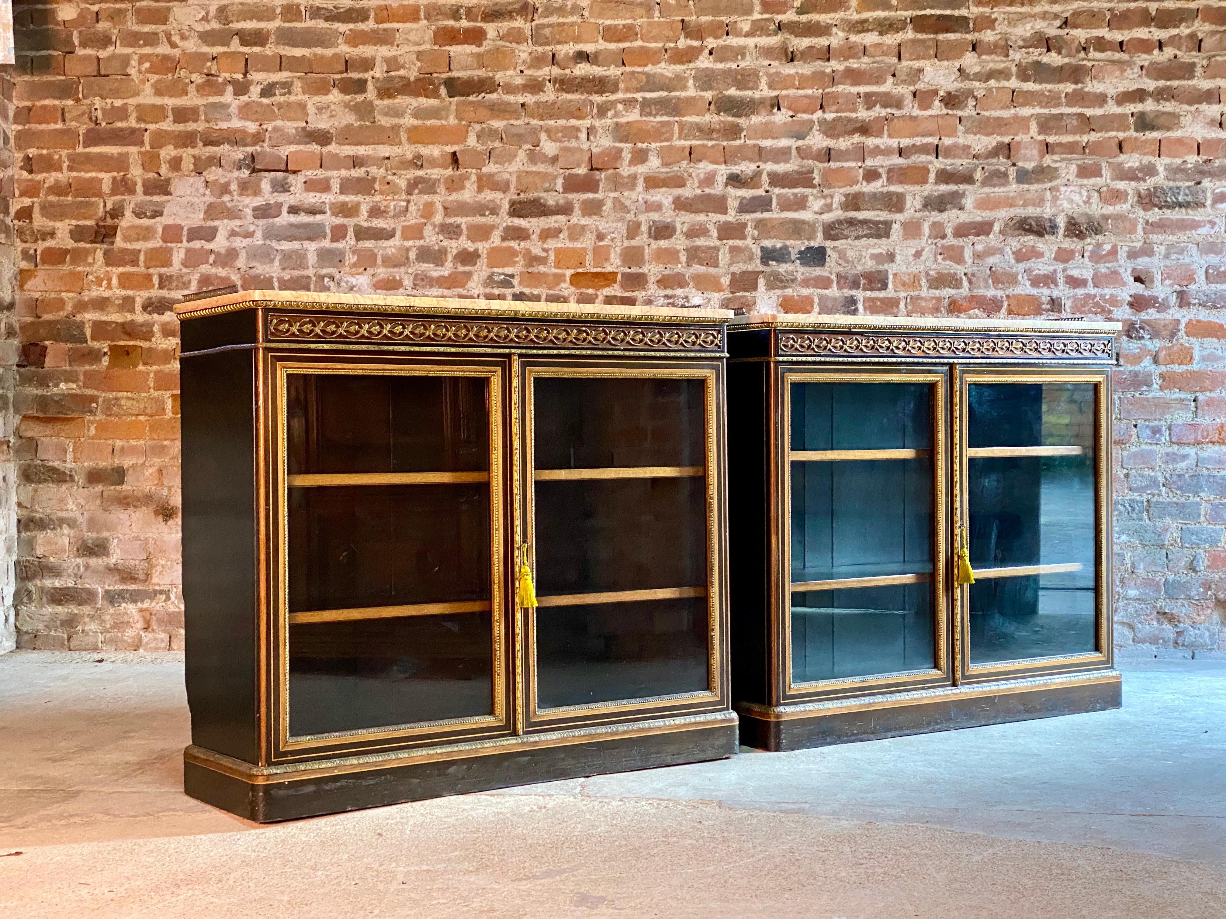 James lamb of Manchester pair of ebonized, walnut and gilt metal mounted pier cabinets, circa 1850.

A pair of important and rare matching pair of 19th Century James Lamb of Manchester Ebonized, Walnut and Gilt metal mounted pier cabinets