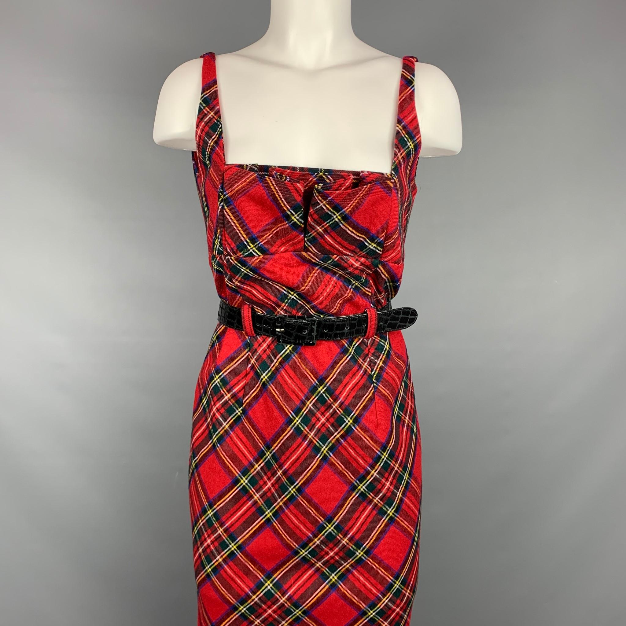 LAMB dress comes in a red plaid wool with a animal print liner featuring a fax patent leather belt, pleated, buttoned straps, and a back zipper closure.

Very Good Pre-Owned Condition.
Marked: 10
Original Retail Price: $680.00

Measurements:

Bust: