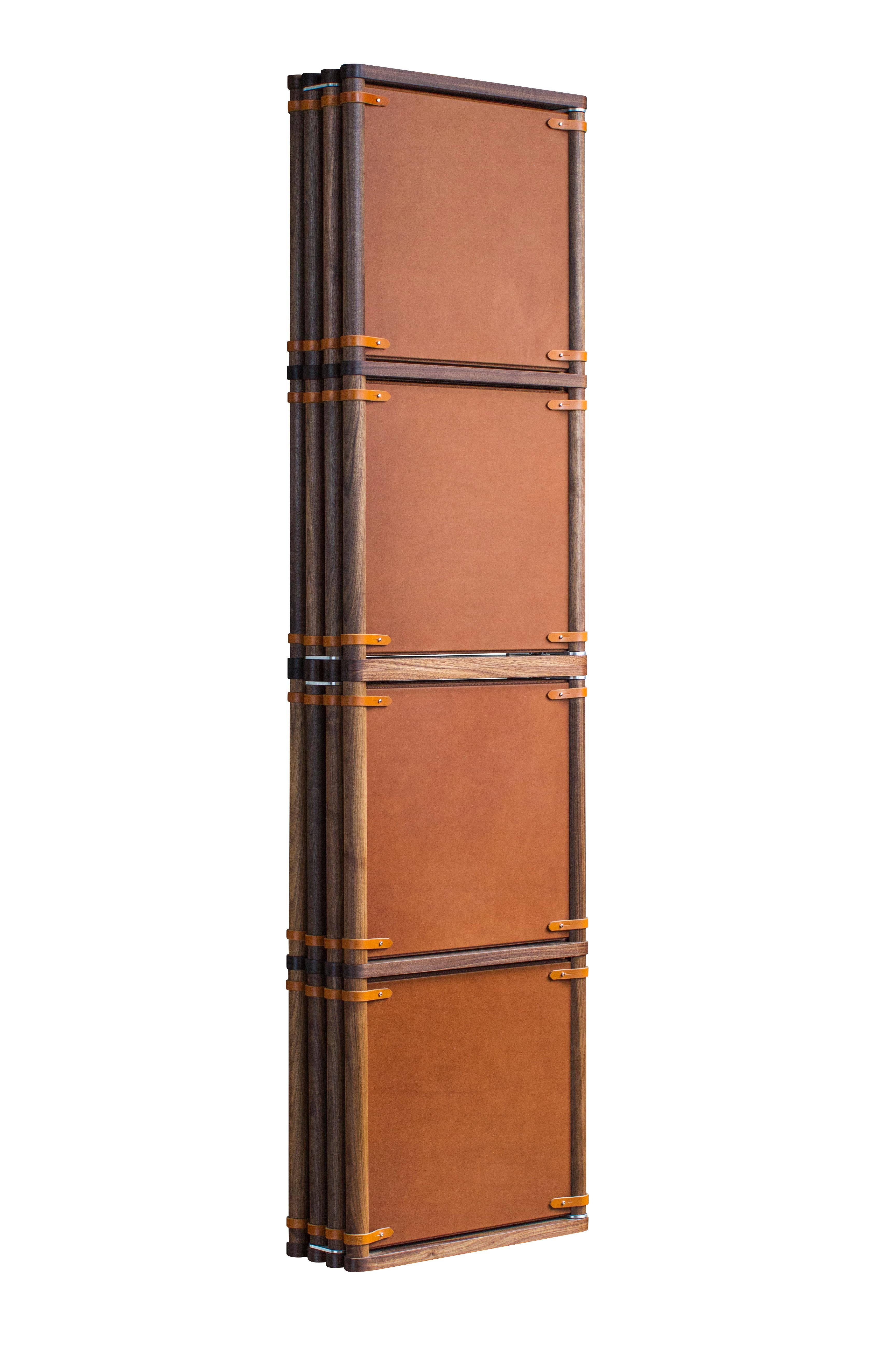 The Lambert Folding Screen Type 2 in oiled walnut with tan leather panels and cognac English bridle leather straps. The Lambert folding screen Type 2 is different from our Type 1 screen in that both sides of the screen are identical. The leather or
