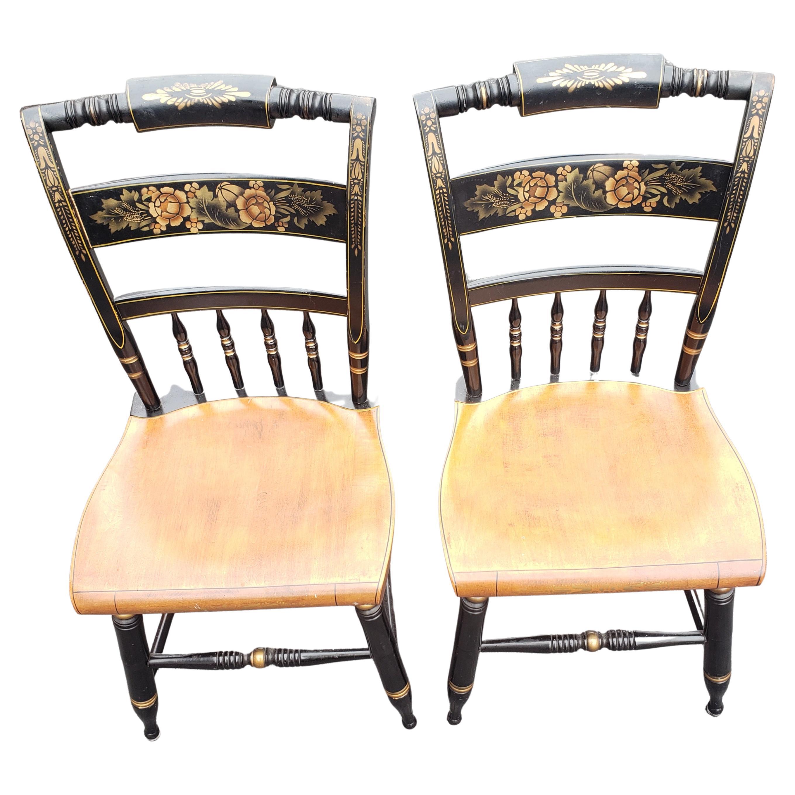 Beautifully designed and painted pair of Lambert Hitchcock spindle ladder back chairs in great vintage condition. These are actual Lambert Hitchcock chairs.
Measures 15.5