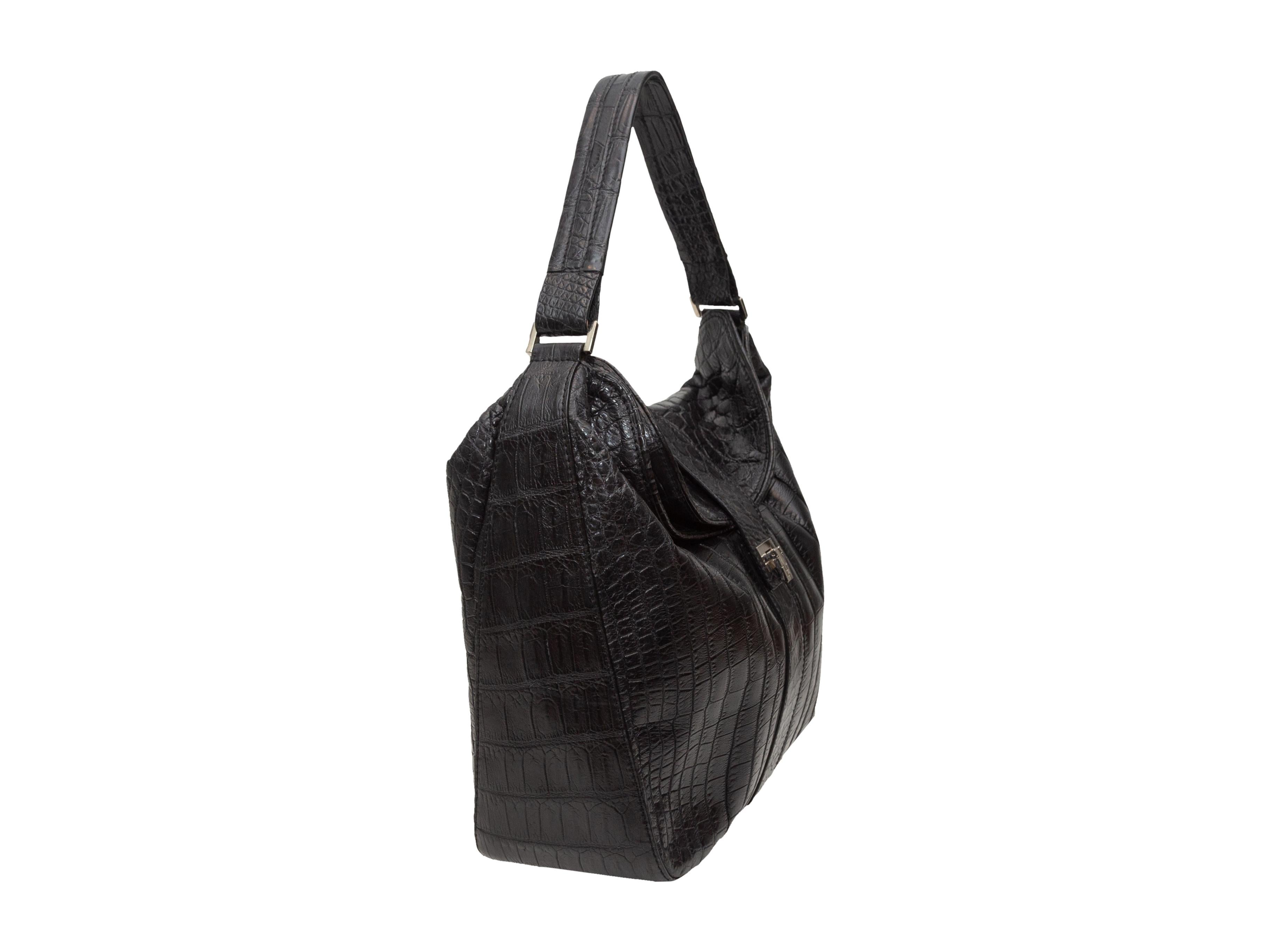 Product details: Black crocodile skin shoulder bag by Lambertson Truex. Silver-tone hardware. Interior zip pocket. Closure at front flap. 12