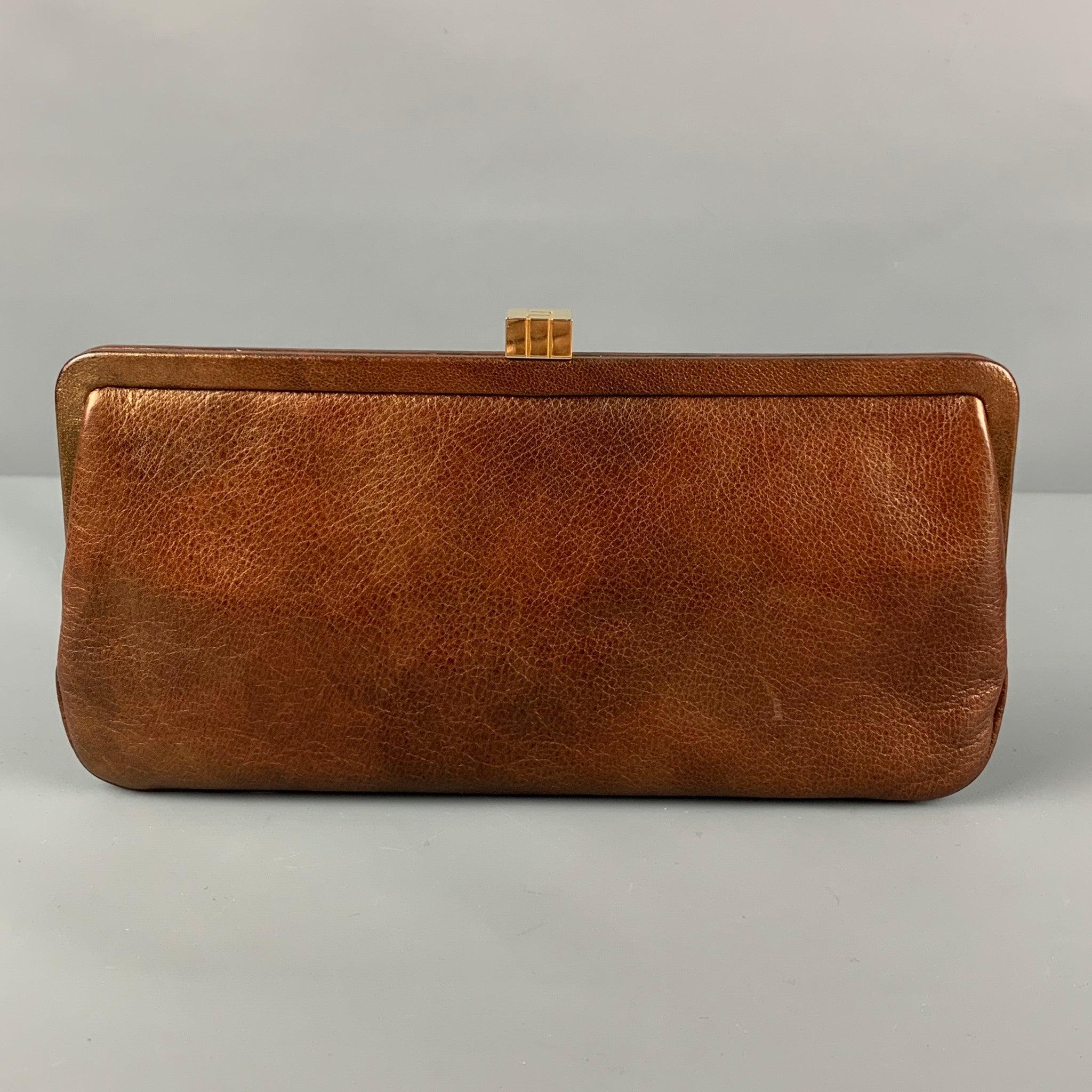 LAMBERTSON TRUEX clutch comes in a brown leather featuring a inner pocket and a push open closure.
Very Good
Pre-Owned Condition. 

Measurements: 
  Length: 9.5 inches  Height: 5 inches  
  
  
 
Reference: 119116
Category: Handbag & Leather