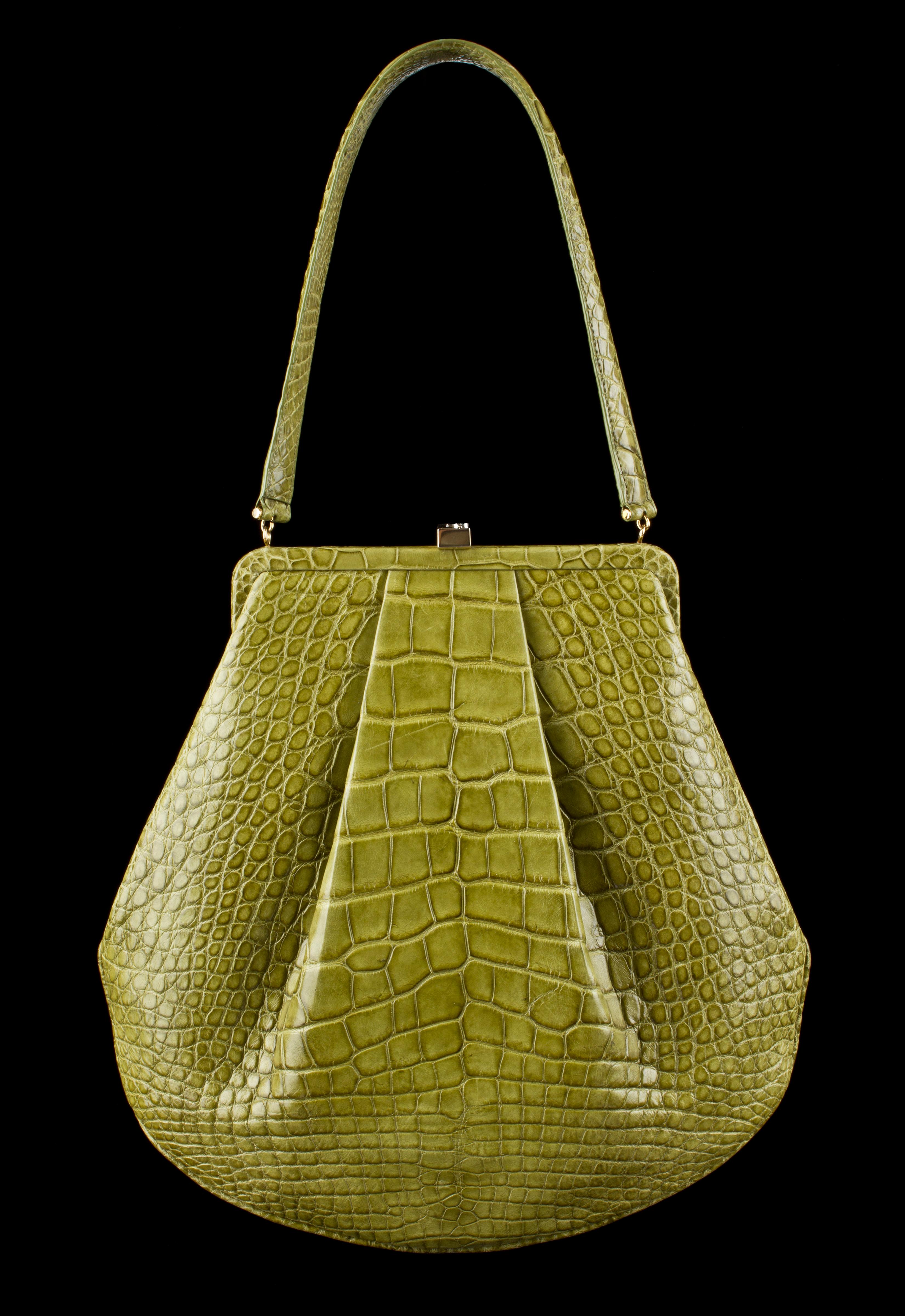 Lambertson Truex green genuine alligator framed shoulder bag. Pleat detail. Hinged frame with gold-tone signature clasp closure at top. Single alligator strap. Interior is light blue suede with alligator detail. Interior has cell phone pocket, two
