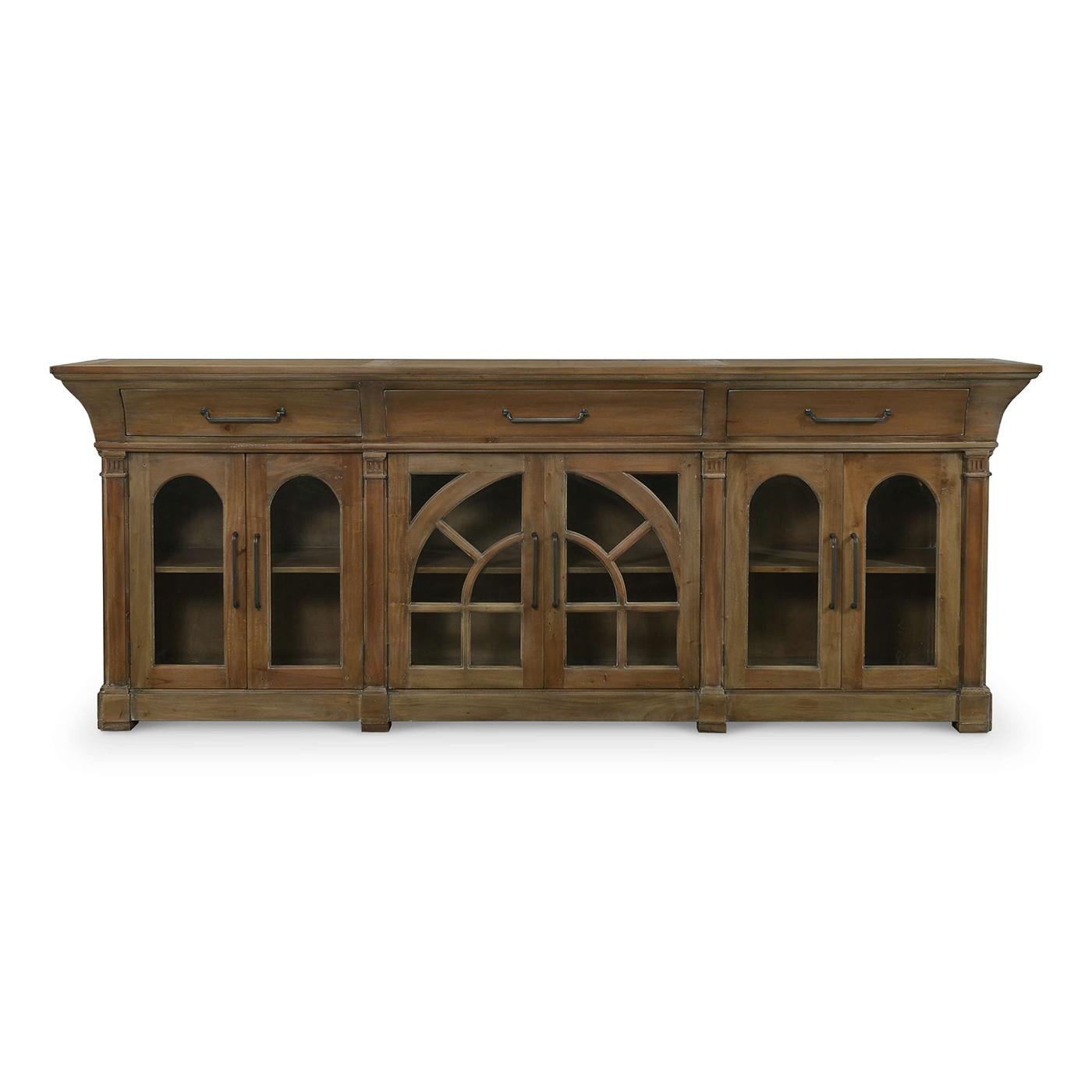 Crafted with meticulous attention to detail, this sideboard seamlessly combines classic design elements with modern functionality.

Constructed with solid mahogany and finished in our medium straw wash, it features intricate arch designs on the