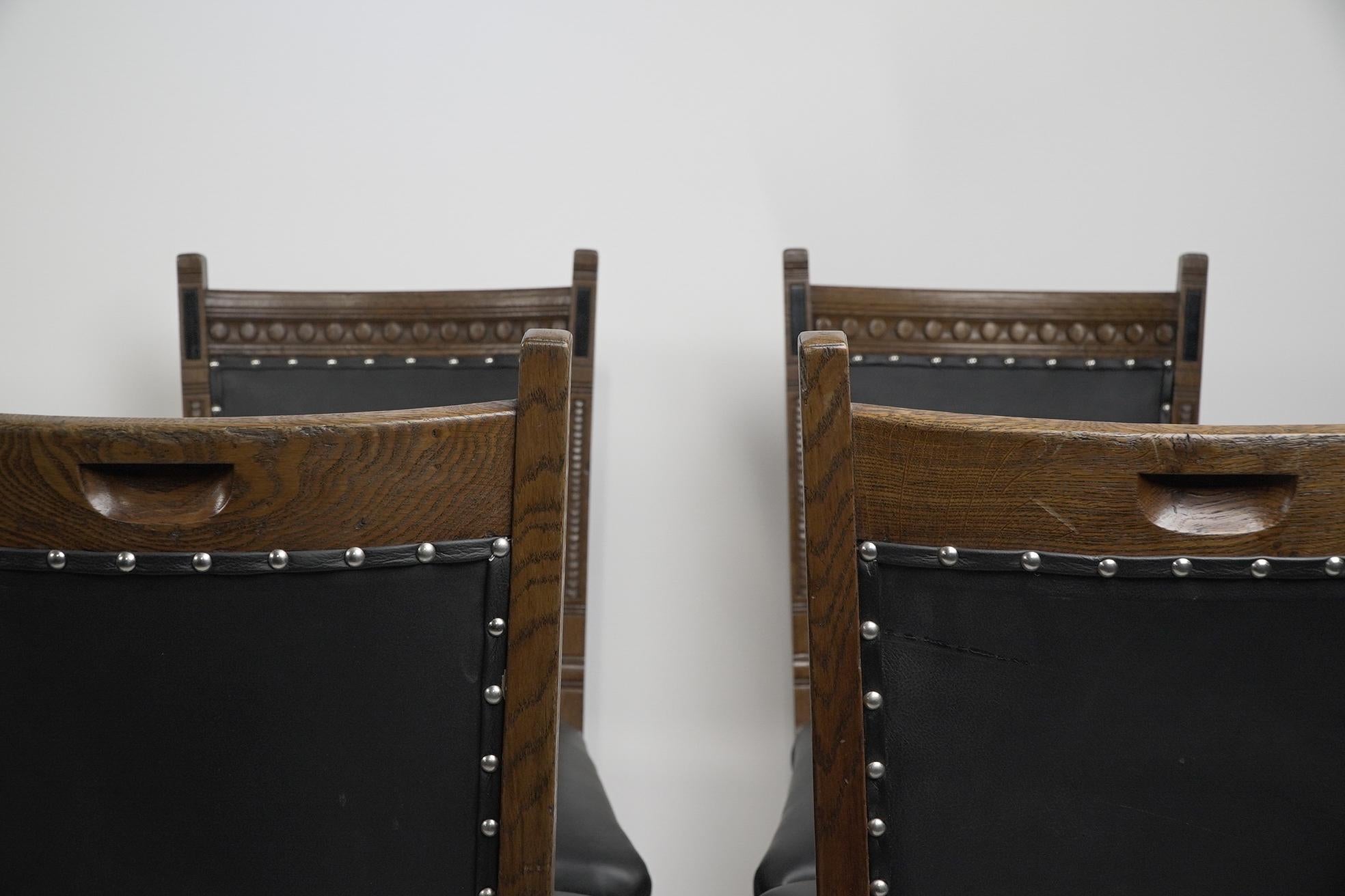 Lambs of Manchester A Set of Four Aesthetic Movement Oak & Leather Dining Chairs For Sale 1