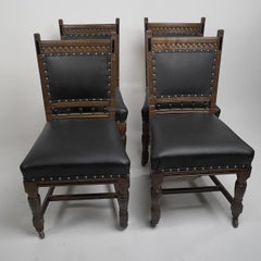 Lambs of Manchester A Set of Four Aesthetic Movement Oak & Leather Dining Chairs