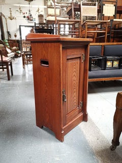 Lambs of Manchester. A Gothic Revival Bedside Cabinet with Carved Floral Details