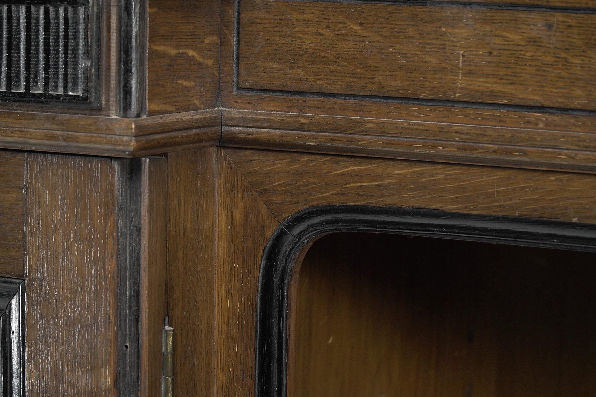 Lambs of Manchester (stamped). A fine Aesthetic Movement oak breakfront bookcase For Sale 8