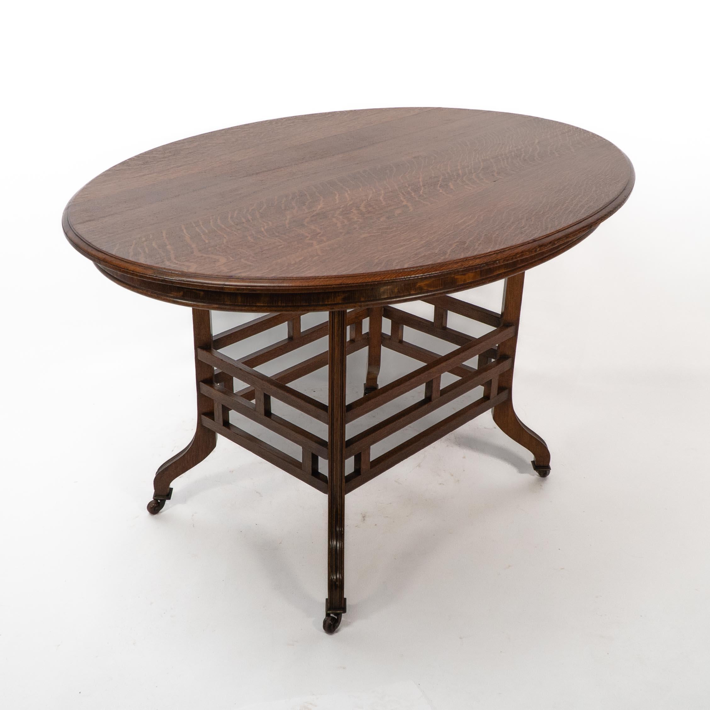 Lambs of Manchester, stamped Lambs. A rare Anglo-Japanese oak oval centre table In Good Condition For Sale In London, GB