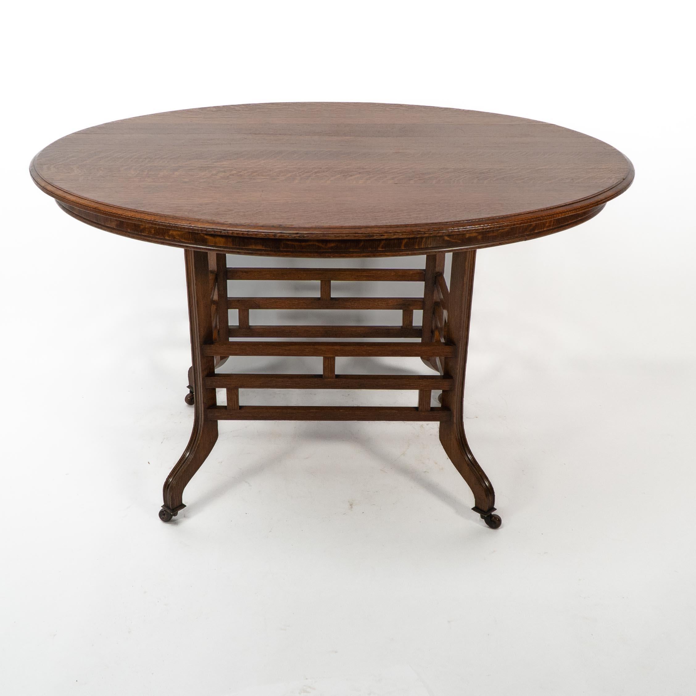 Late 19th Century Lambs of Manchester, stamped Lambs. A rare Anglo-Japanese oak oval centre table For Sale