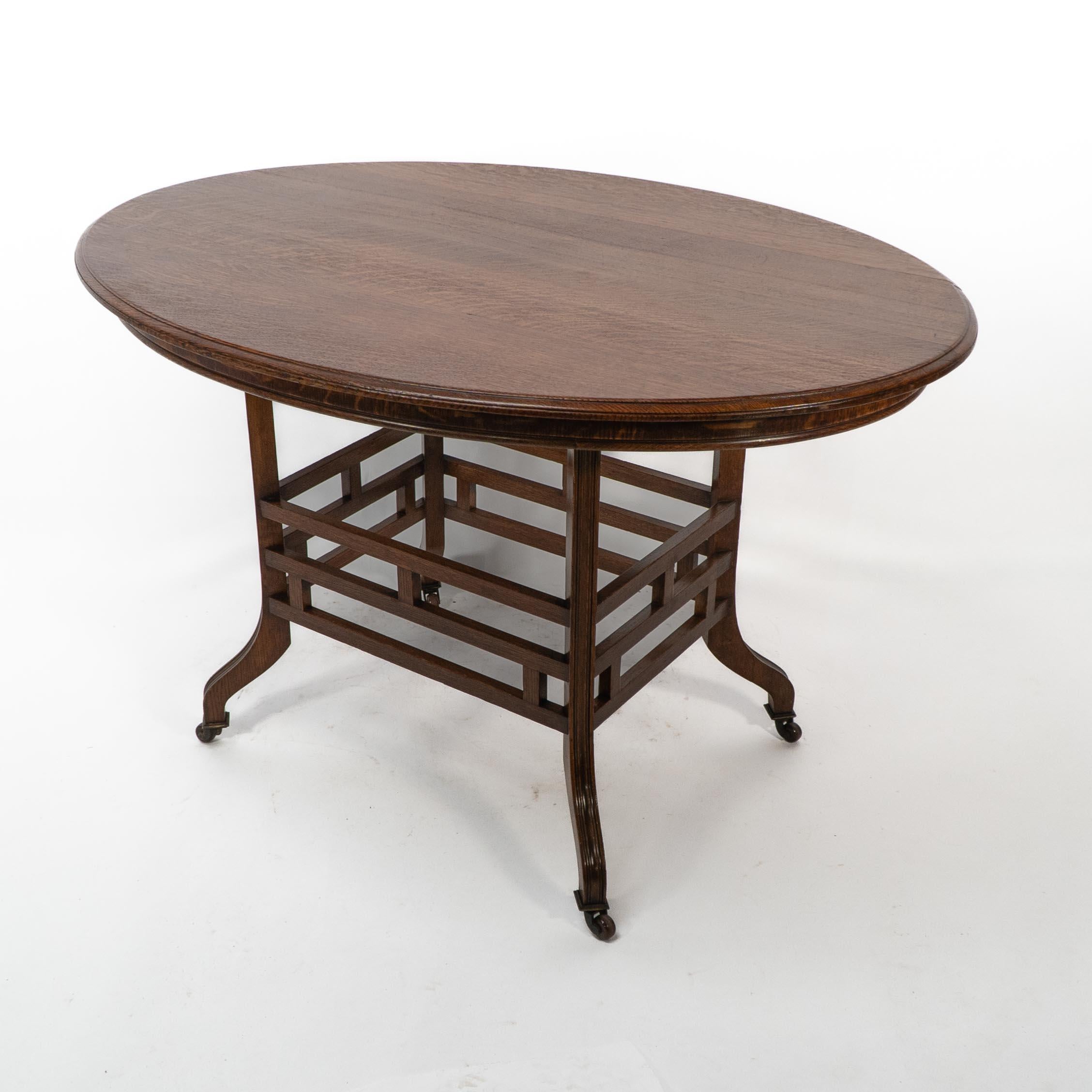 Oak Lambs of Manchester, stamped Lambs. A rare Anglo-Japanese oak oval centre table For Sale