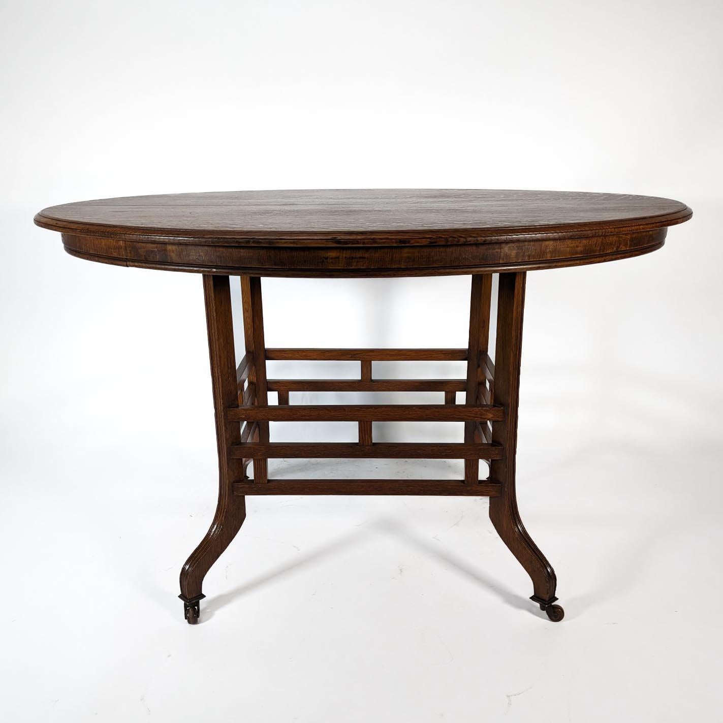 Lambs of Manchester, stamped Lambs. A rare Anglo-Japanese oak oval centre table For Sale 1