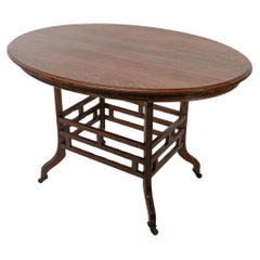 Lambs of Manchester, stamped Lambs. A rare Anglo-Japanese oak oval centre table
