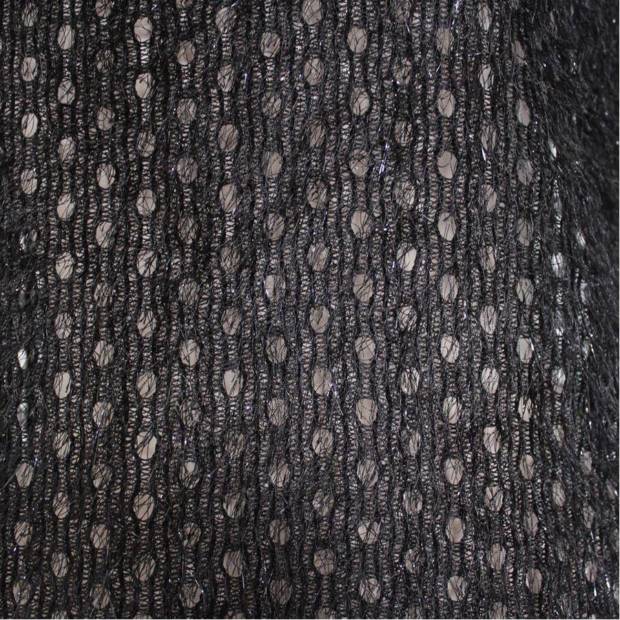 Polyester Black color Perforated fabric Sleeveless Total length cm 55 (15.7 inches) Shoulders cm 32 (12.5 inches)
