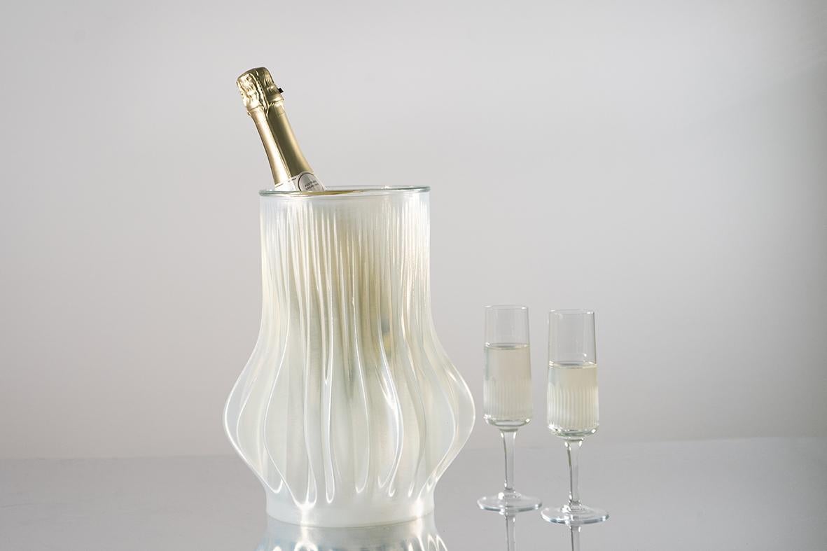 Champagne Cooler of the Lamella Series. 

The Lamella Champagne Cooler consists of a 3D printed pot with a glass insert, that is available in different colors.They are inspired by the lamellas and gills of fungi and are digitally designed and