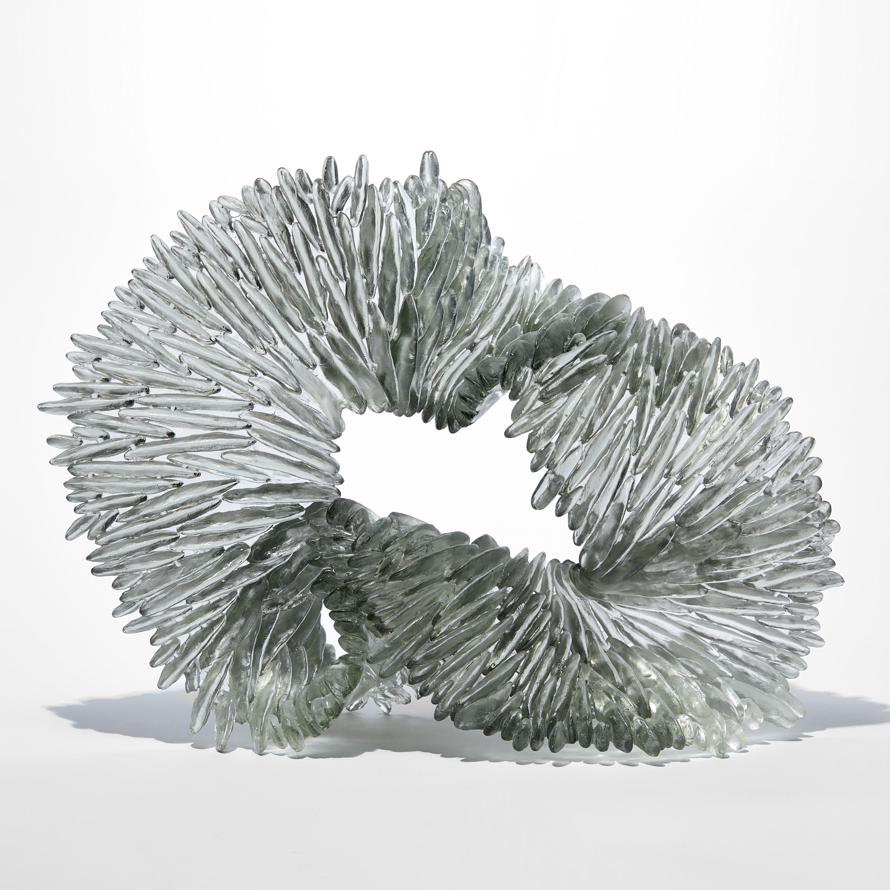 'Lamellae I' is a unique glass sculpture by the British artist, Nina Casson McGarva.

Casson McGarva firstly casts her glass in a flat mould where she introduces all of the beautifully detailed, scaled surface texture, all unique and to her distinct