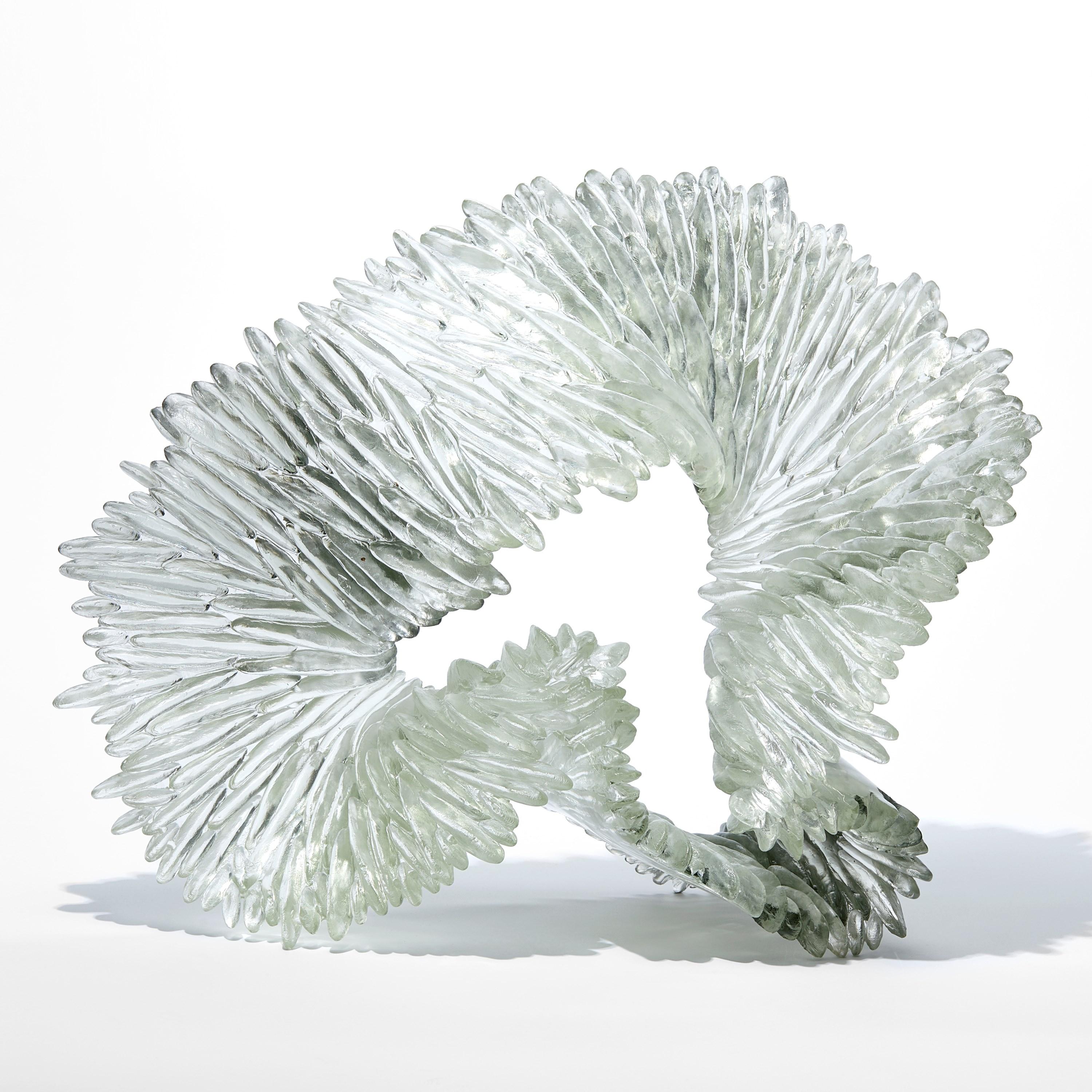 'Lamellae II' is a unique glass sculpture by the British artist, Nina Casson McGarva.

Casson McGarva firstly casts her glass in a flat mould where she introduces all of the beautifully detailed, scaled surface texture, all unique and to her