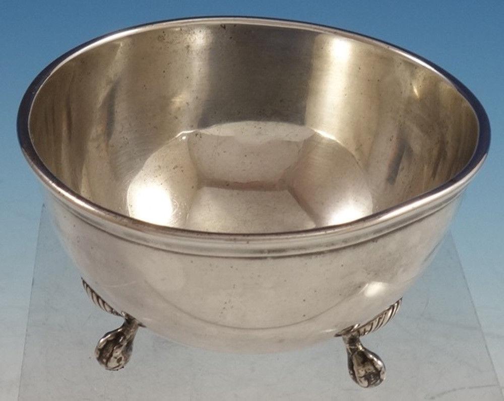 Lamerie by Tuttle 
Wonderful Lamerie by Tuttle sterling silver bowl with three applied shell feet. This piece is marked #1273.
The bowl measures 2 5/8 tall x 4 1/2 in diameter, and it weighs 5.78 troy ounces. It is not monogrammed and is in good