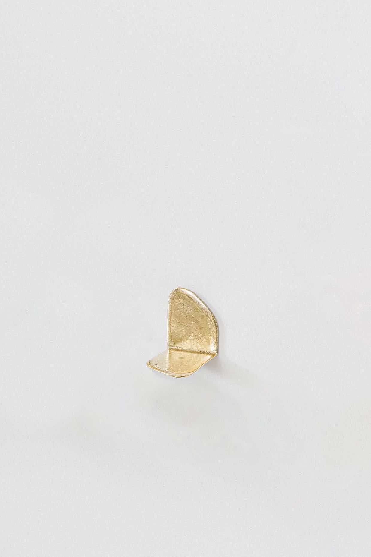 “Lâmina” (2025) designed by Lucas Recchia is a series of six individual small shelves, each with its own unique form and proportion, cast in unpolished bronze. The pieces highlight Recchia’s refined exploration of material tactility and minimalist