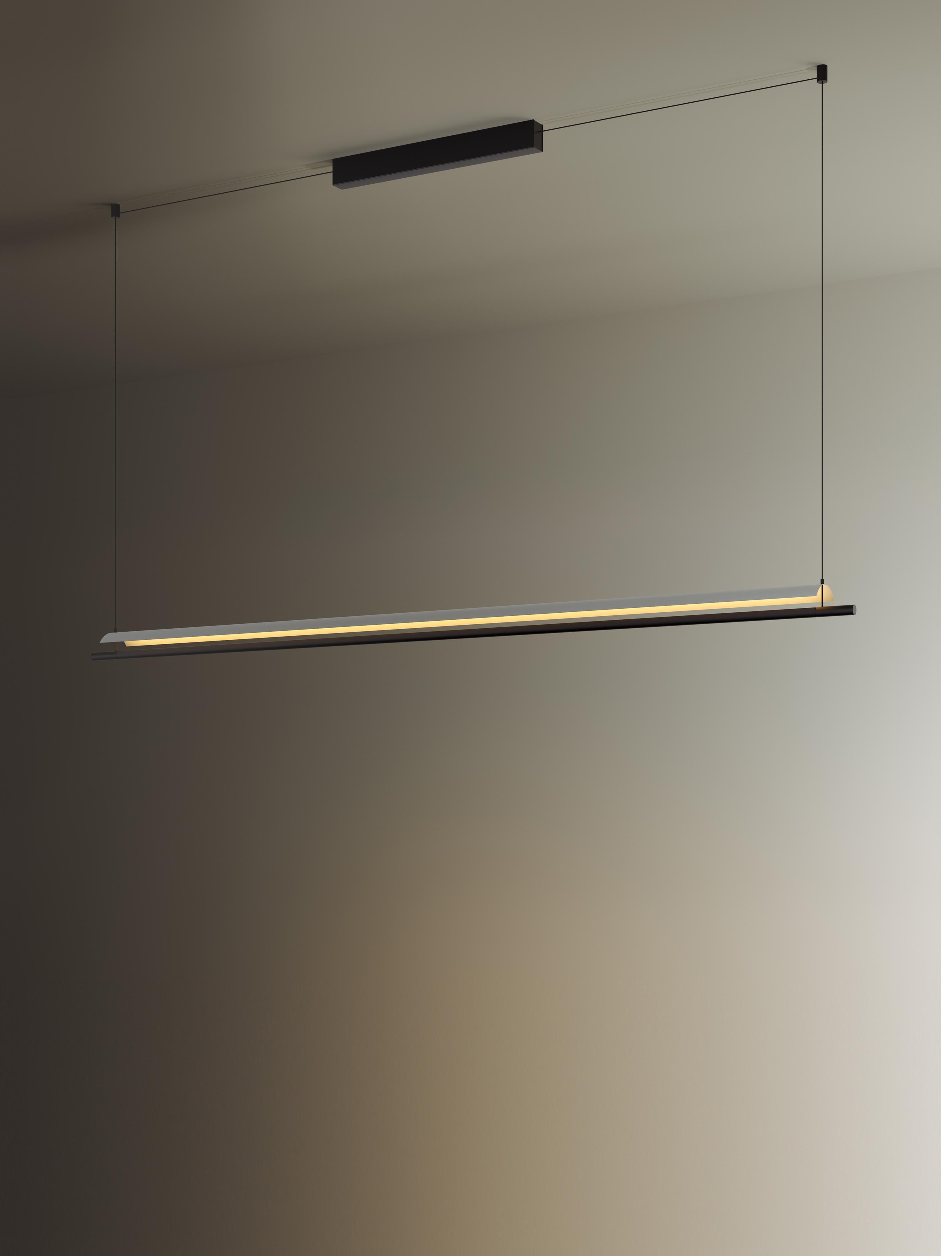 Lámina 165 pendant lamp by Antoni Arola
Dimensions: d 179.8 x w 9.15 x h 4 cm
Materials: Metal, plastic.
Available in other sizes.

A line of light and a thin metal sheet create a soft but effective levity. A marriage of the poetic and the