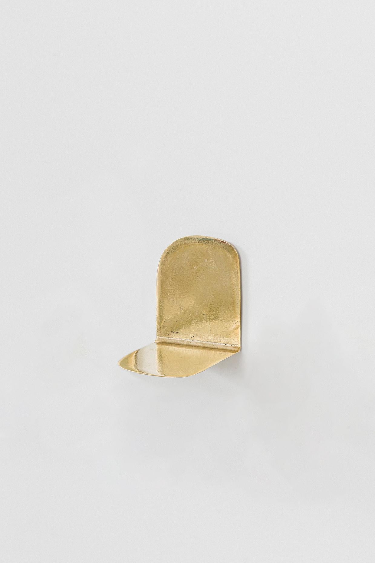 “Lâmina” (2025) designed by Lucas Recchia is a series of six individual small shelves, each with its own unique form and proportion, cast in unpolished bronze. The pieces highlight Recchia’s refined exploration of material tactility and minimalist