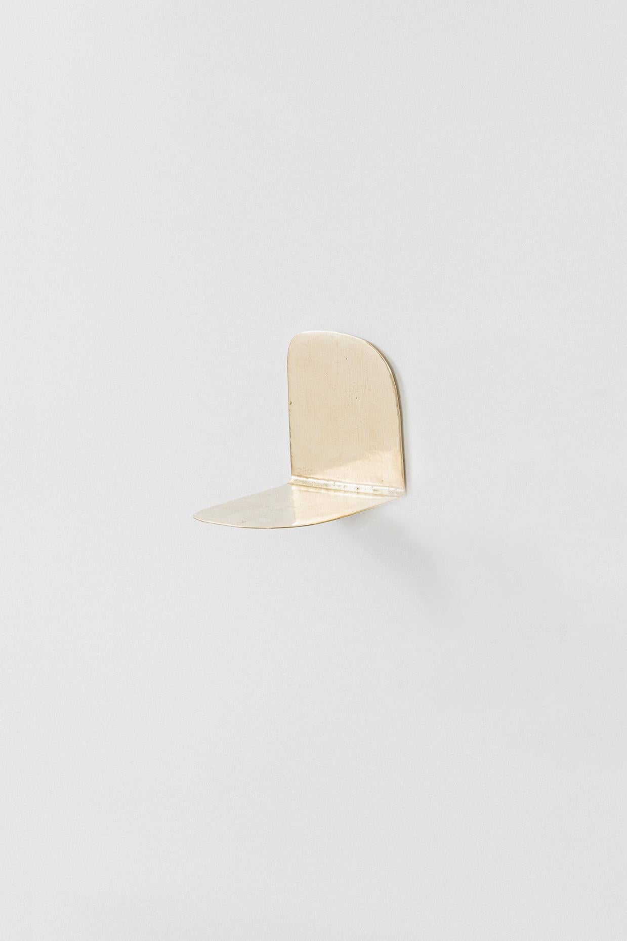 “Lâmina” (2025) designed by Lucas Recchia is a series of six individual small shelves, each with its own unique form and proportion, cast in unpolished bronze. The pieces highlight Recchia’s refined exploration of material tactility and minimalist