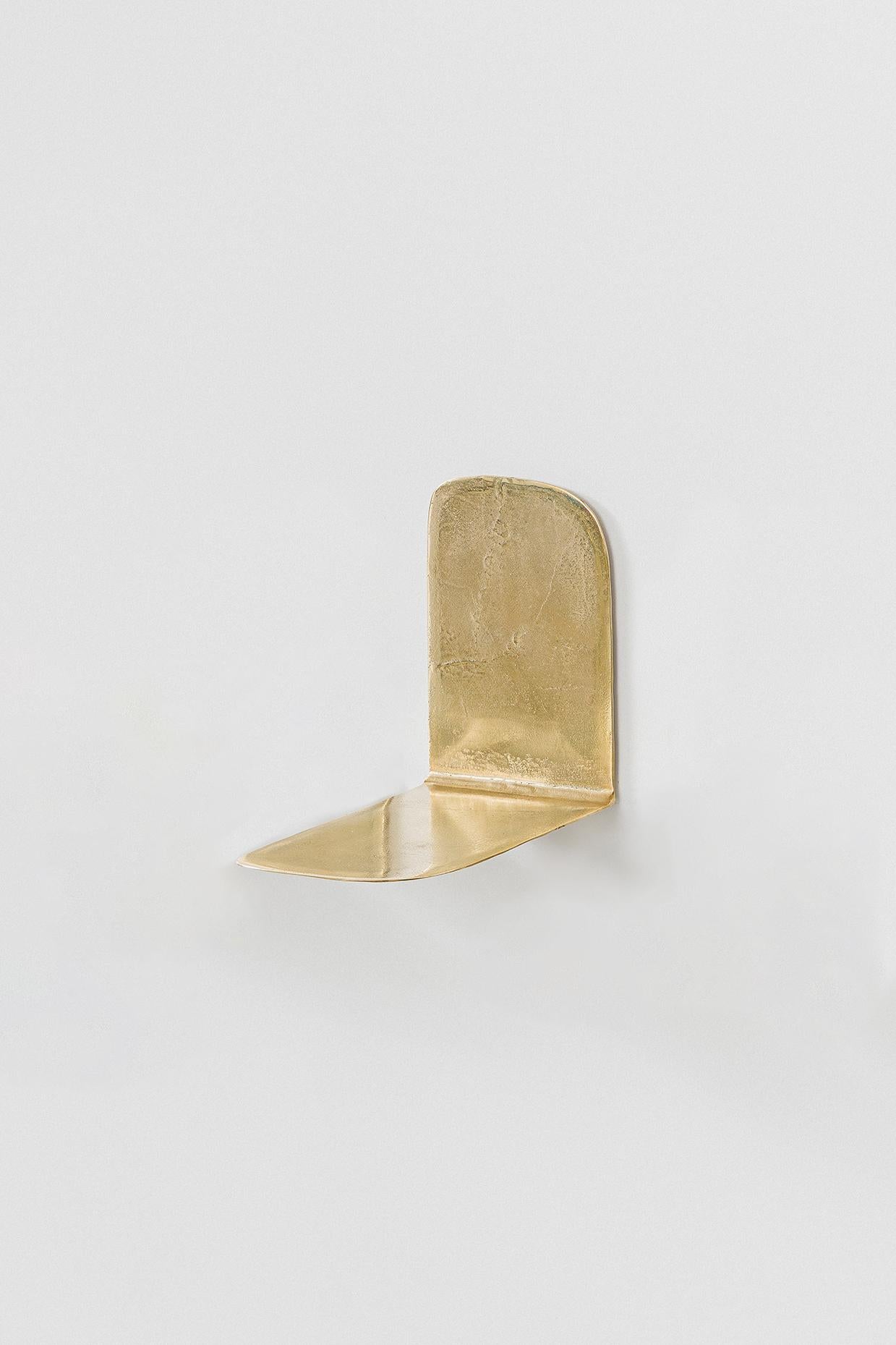 “Lâmina” (2025) designed by Lucas Recchia is a series of six individual small shelves, each with its own unique form and proportion, cast in unpolished bronze. The pieces highlight Recchia’s refined exploration of material tactility and minimalist