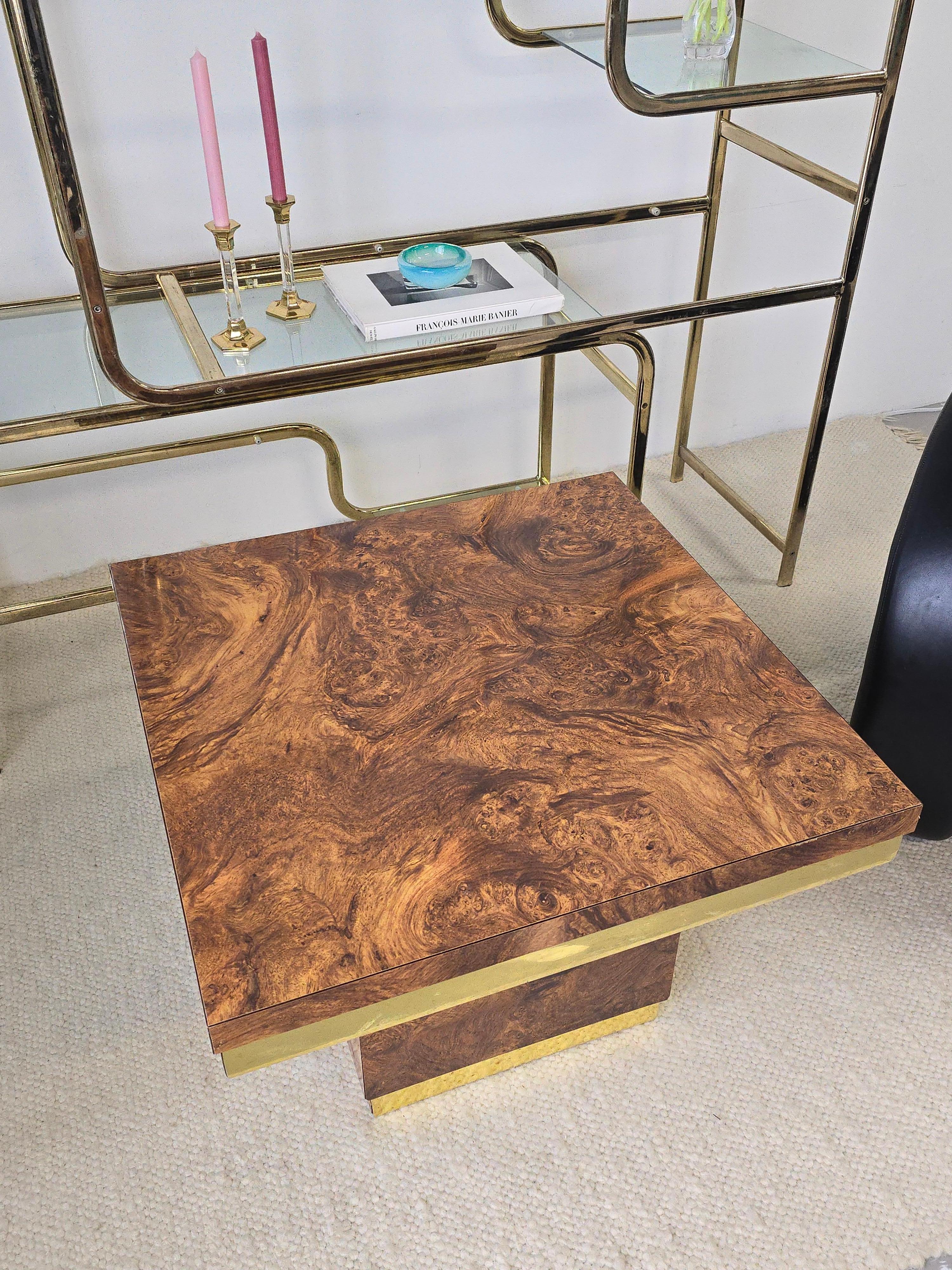 Gorgeous laminated 'burlwood' table with brass detailing. This lovely piece can be used as am end or side table. It was made in the 1970s and similar to the style of Milo Baughman. Its laminated with the look of burlwood which makes it ideal for
