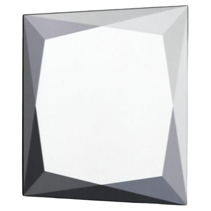 Following the success of our gem tables, our new mirror collection explores the facets found in gemstones through layers of color and varying transparency. This square shaped gem mirror is composed of low iron clear/ low iron mirrored glass with a
