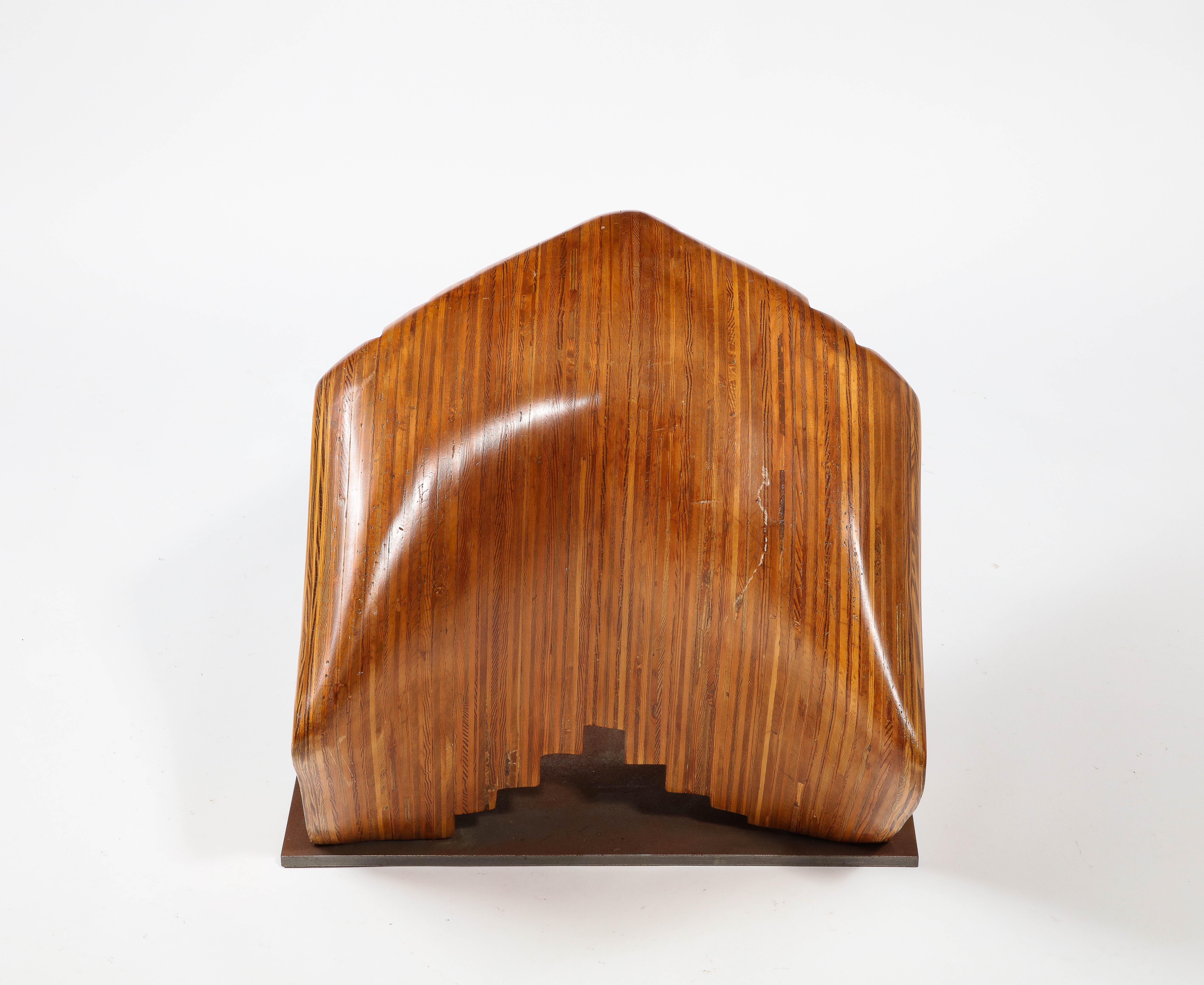 Object / Stool in laminated hardwood, a style seen in the work of Teinreiro and Cospen, a fascinating shape that can be both an object and a seat.