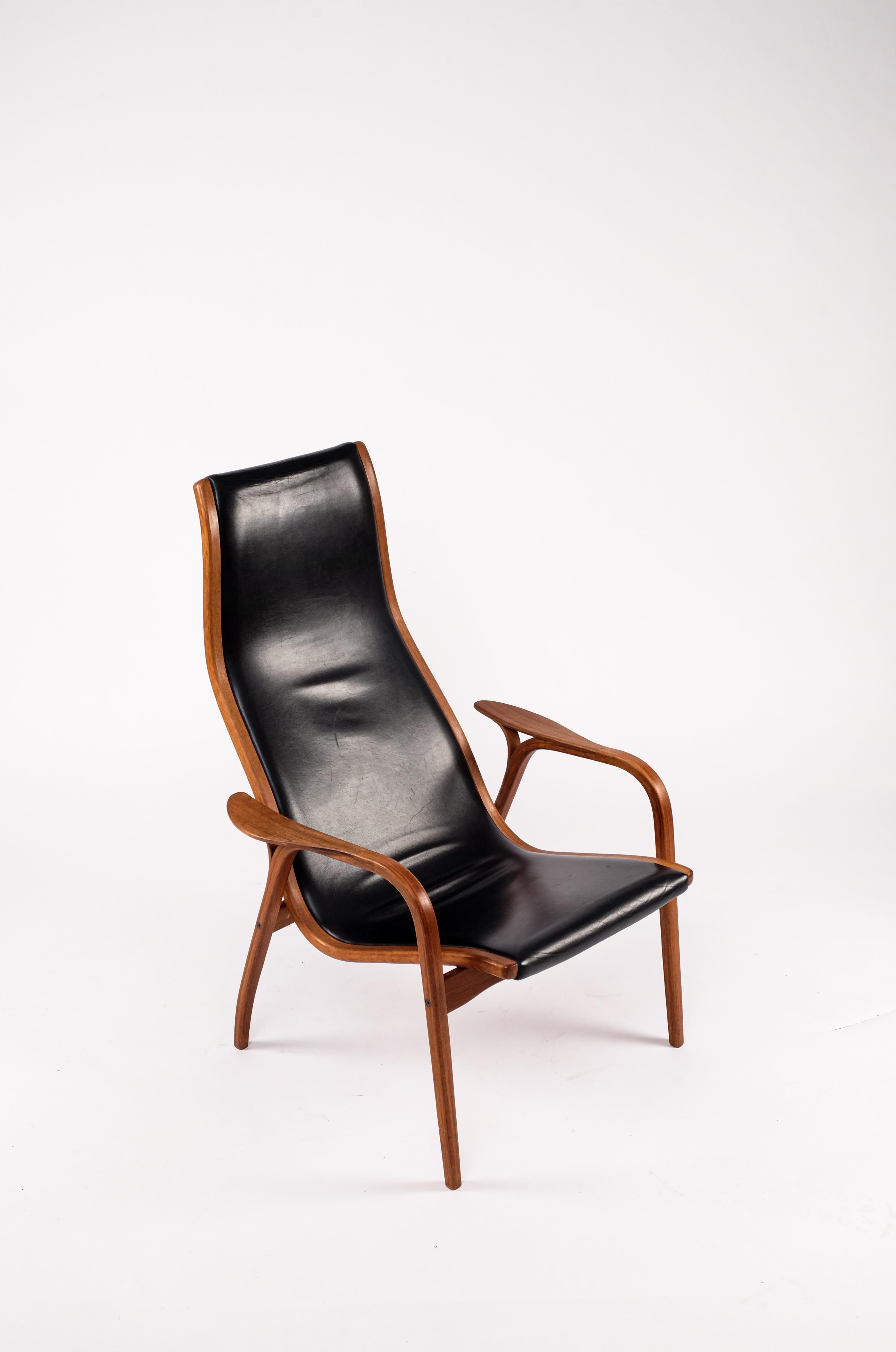 Scandinavian Modern Lamino chair by Yngve Ekström for Swedese. This chair features bentwood teak construction with original black leather upholstery.