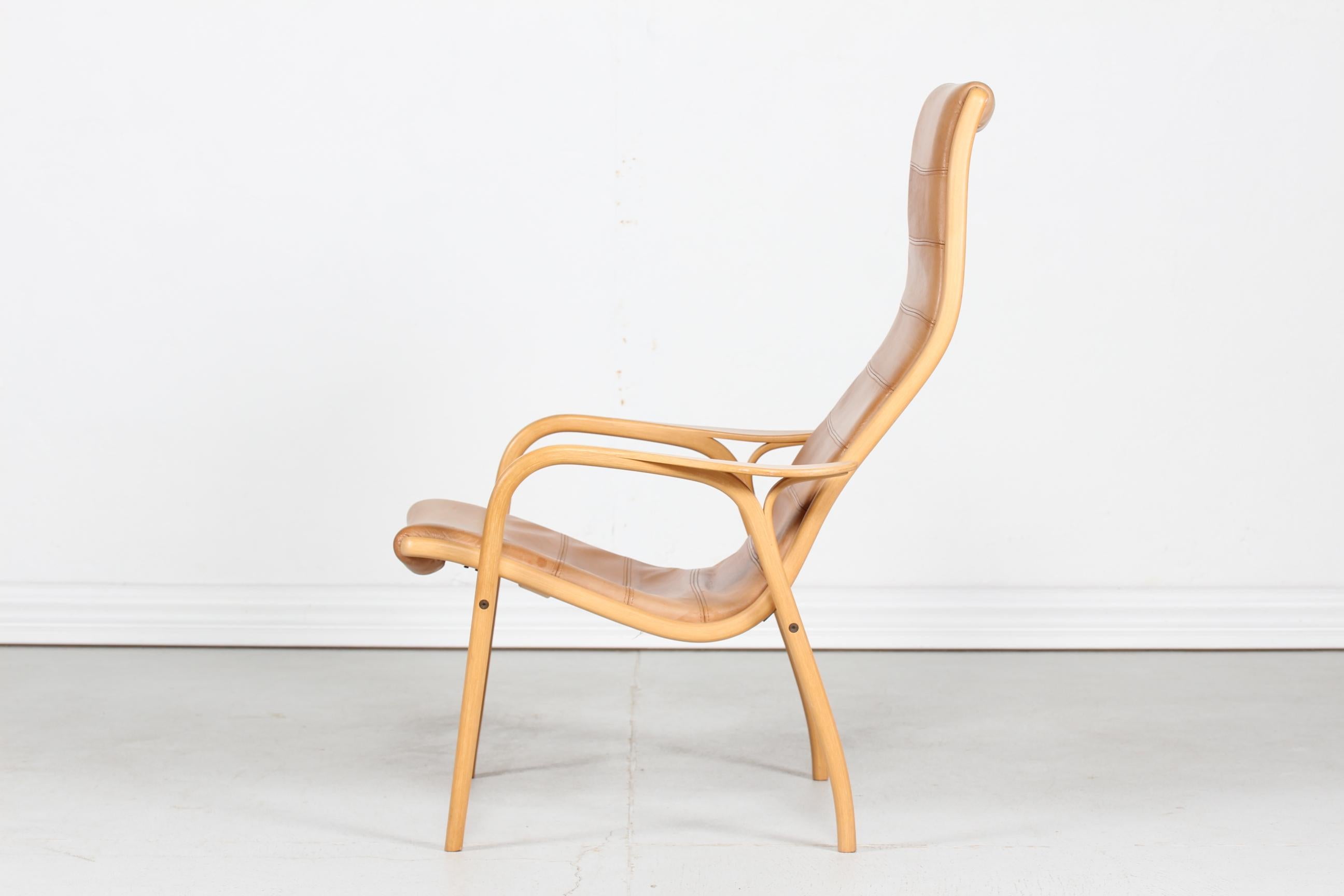 Mid-Century Modern Lamino Chair by Yngve Ekström with Cognac Colored Leather Made by Swedese Sweden For Sale