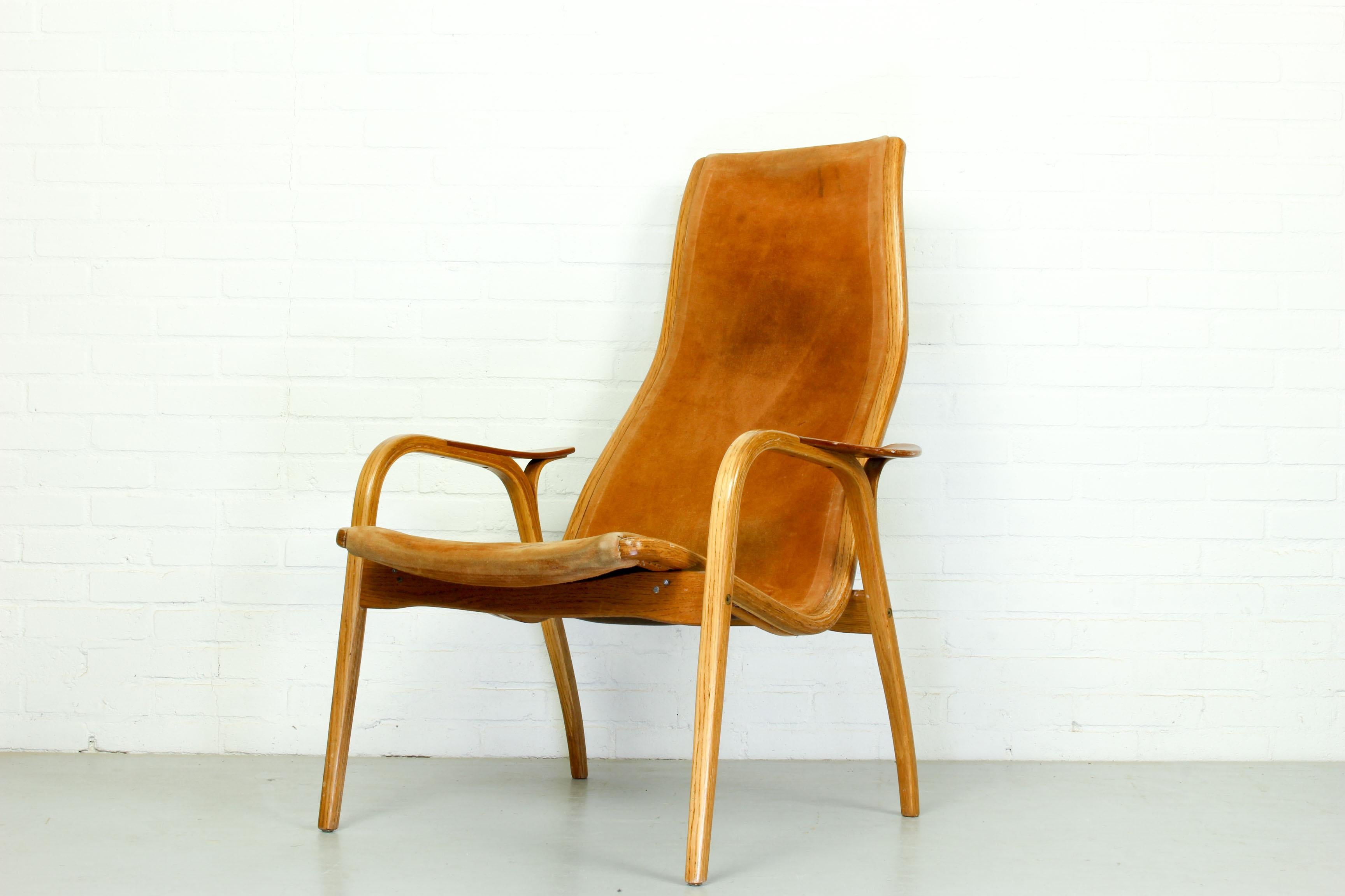 ‘Lamino' armchair in oak with teak armrest designed by Yngve Ekström and made by Swedese. Teak and leather, Sweden, 1970s.