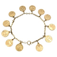 L'Amour Pulsera con Dije de Moneda de los 12 Meses del Año en Oro Amarillo de 14 Kilates