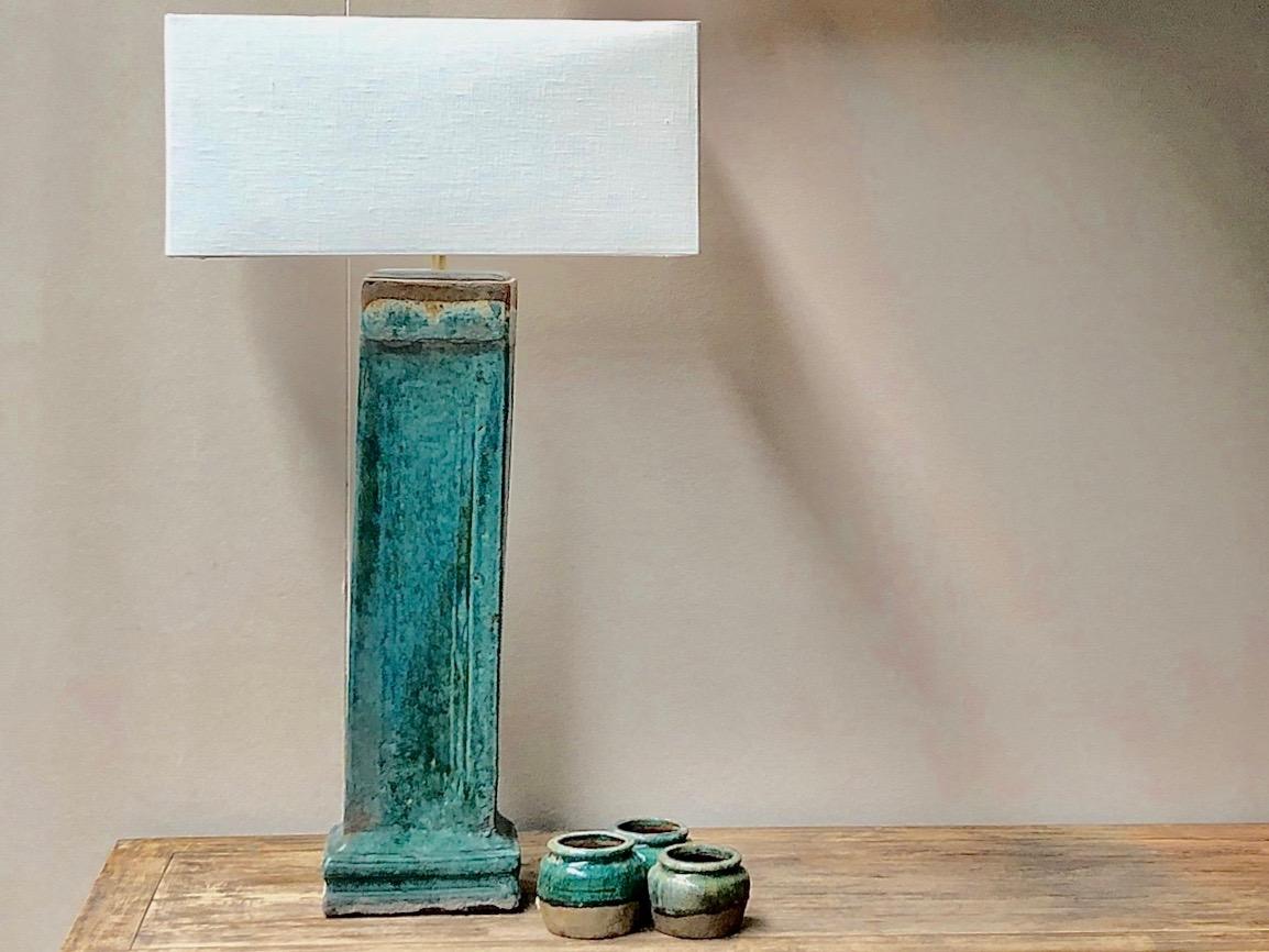 Beautiful antique glazed water pipe converted into a lamp.

The color is lovely, turquoise, my favorite color to use as a strong touch in interiors.

origin Asia
