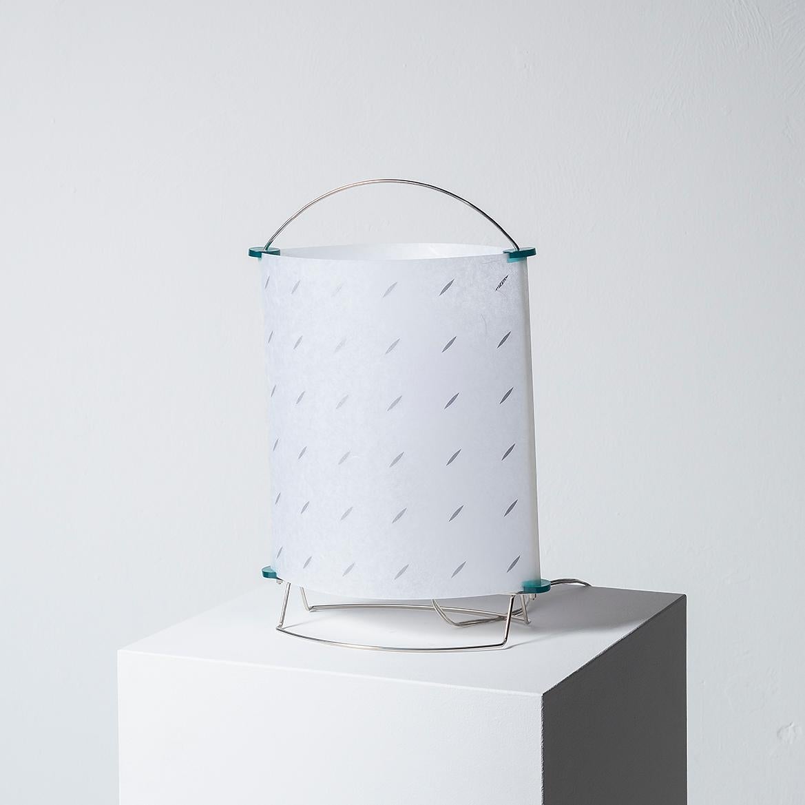 This lamp was designed by Masunori Umeda and manufactured by Yamagiwa Edition in 1996. It is the model n°S2473 from the ‘Be-Andon’ collection with original box and label.
Dimensions: W 28 × D 13 x H 42 cm
Material: Chromed metal, plastic and printed