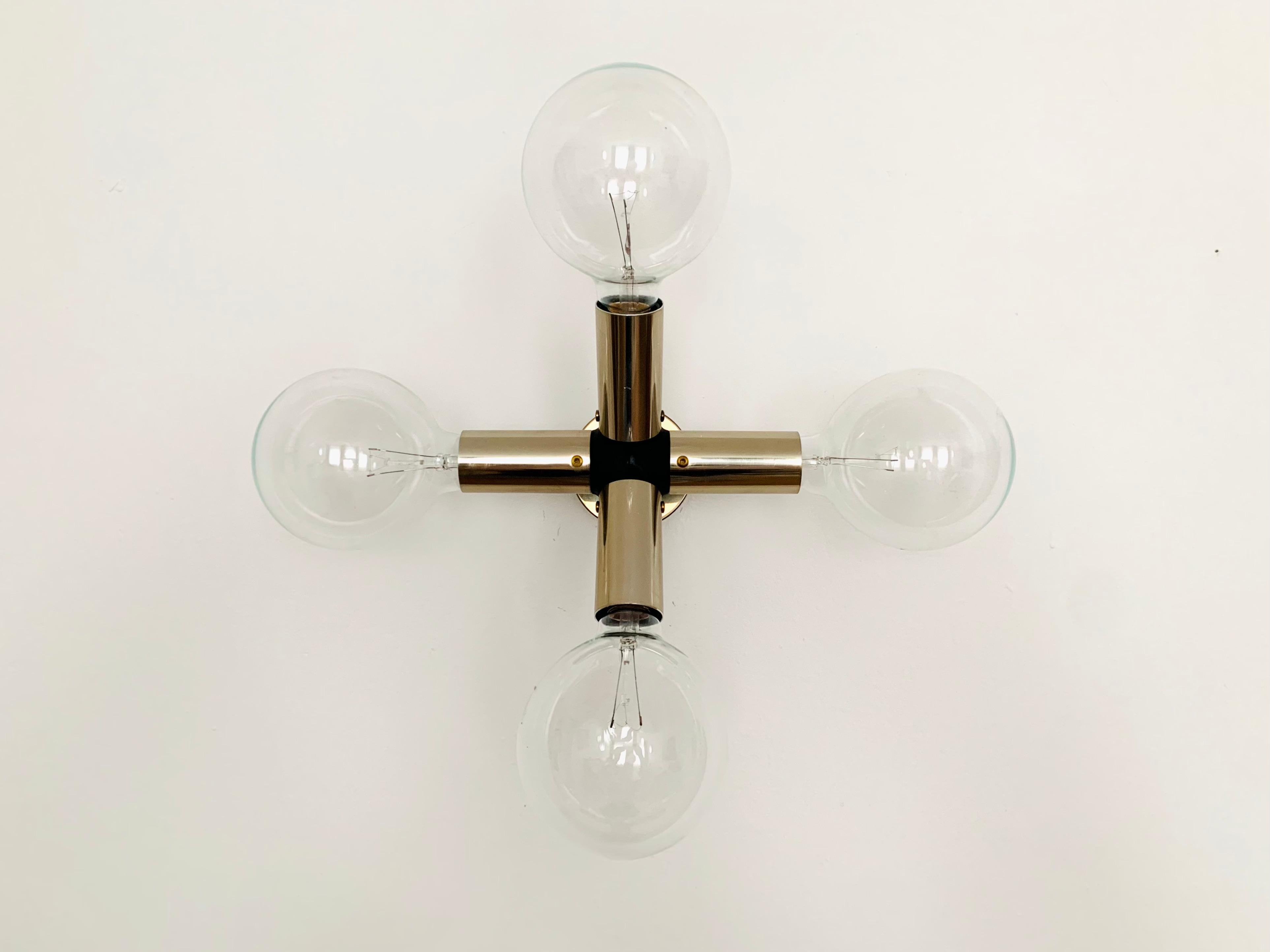 Very impressive Sputnik wall or ceiling lamp from the 1960s.
Exceptional design and very high-quality workmanship.
The lamp is a highlight for every room.
The smoky gold finish is rare.

Manufacturer: Swiss Lamps International
Design: Trix and