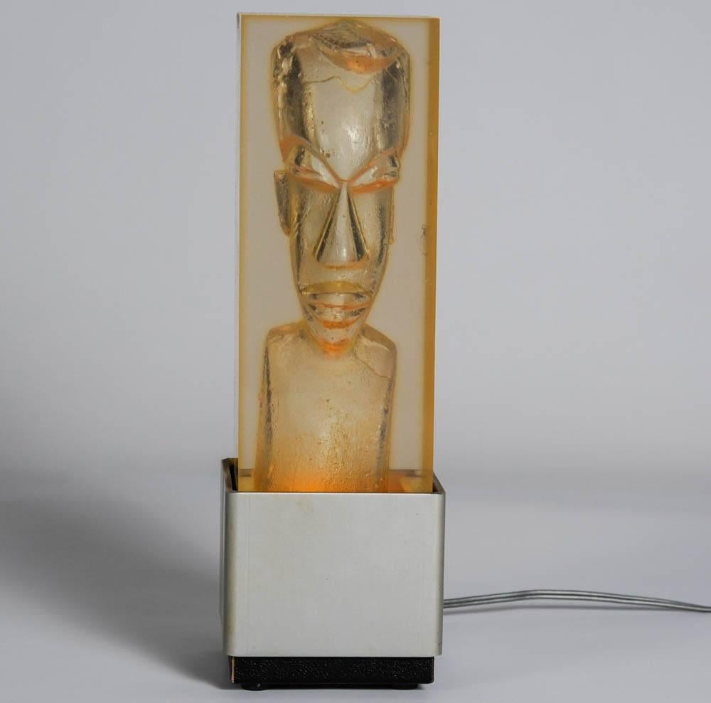 Original Lucite lamp carved with a head inside in the style of Romeo Paris.