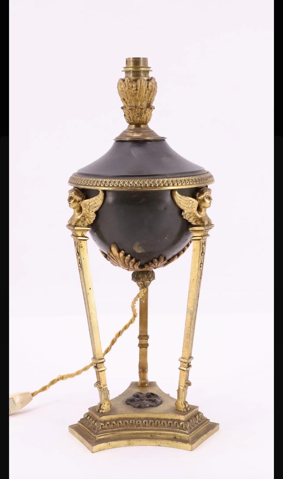 Magnificent late 19th century mantelpiece set, mounted as a lamp.
This beautiful Athenian-style cassolette is made of chased and gilded bronze and brass with a brown patina. The central part forms a vase supported by three uprights.
This
